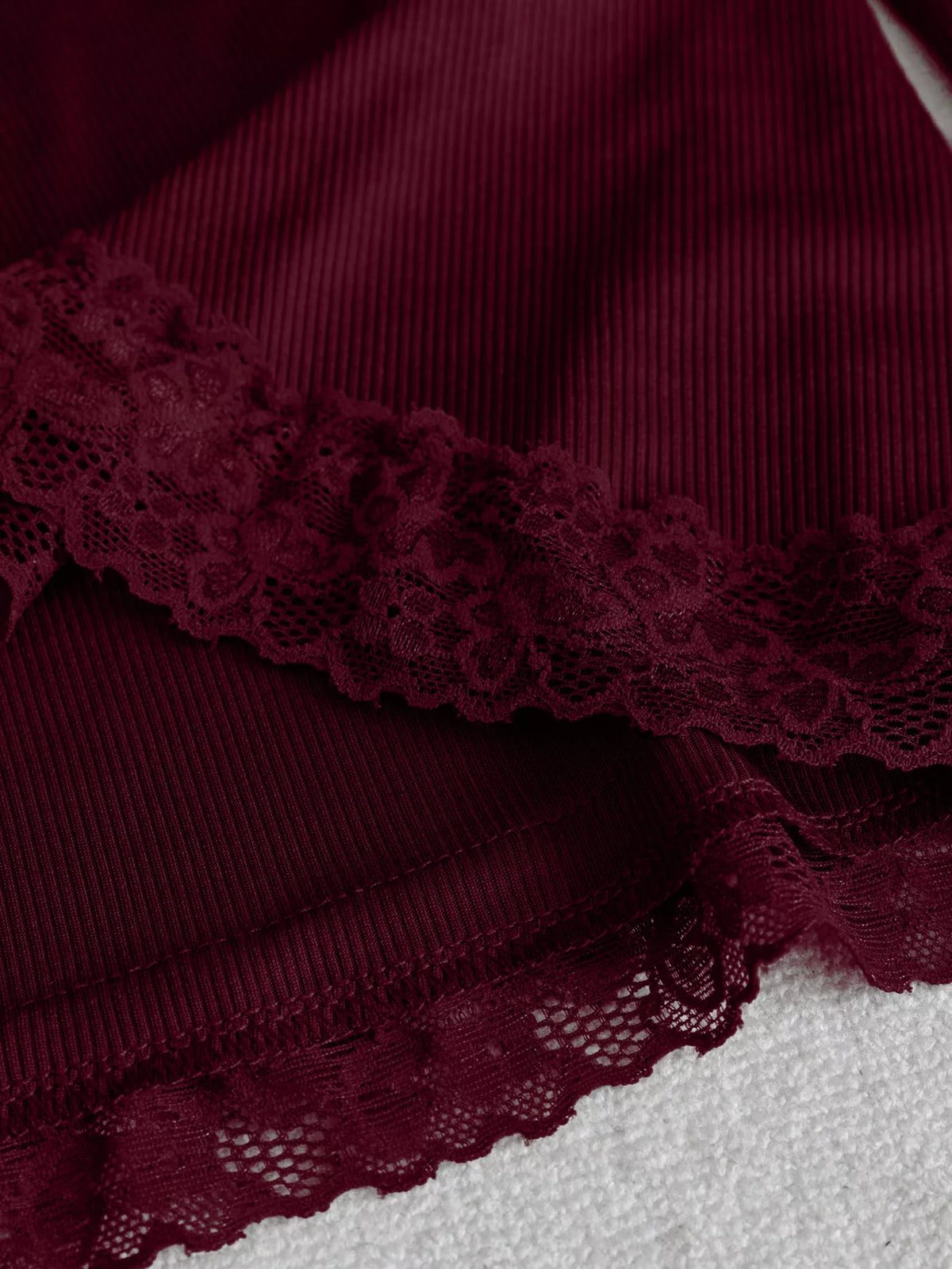 Women's Lace Trim Flare Sleeve Blouse in burgundy — waist detail view