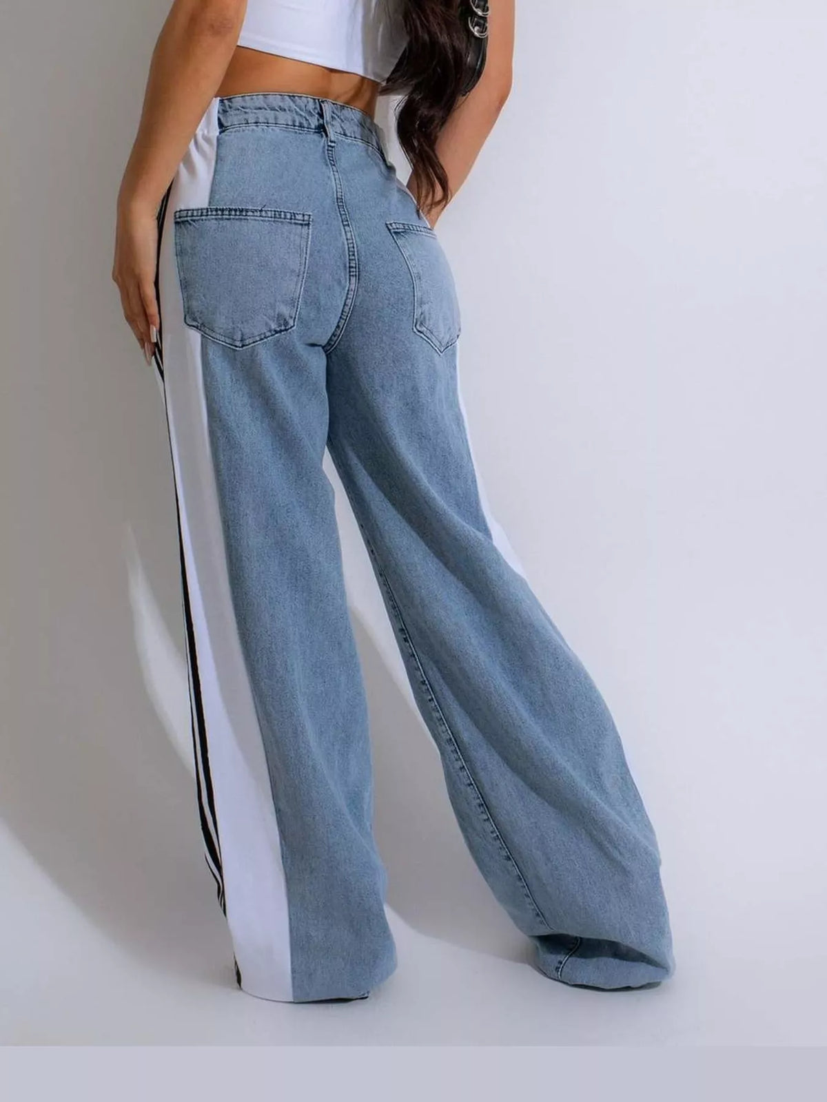 White high-waisted wide-leg jeans with side stripe detail, back view