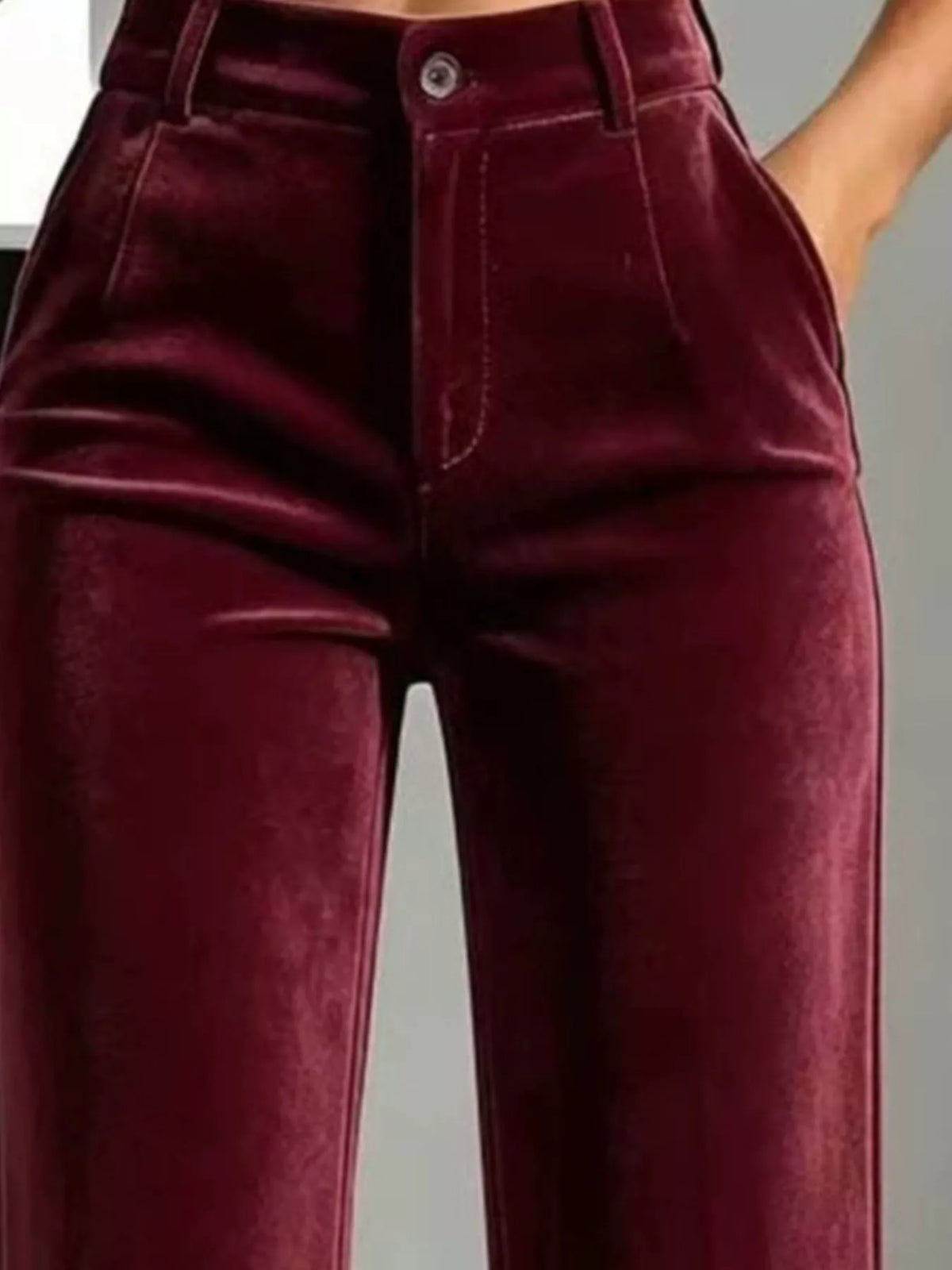 Burgundy velvet pants, buttoned waist, belt loops, and side pockets
