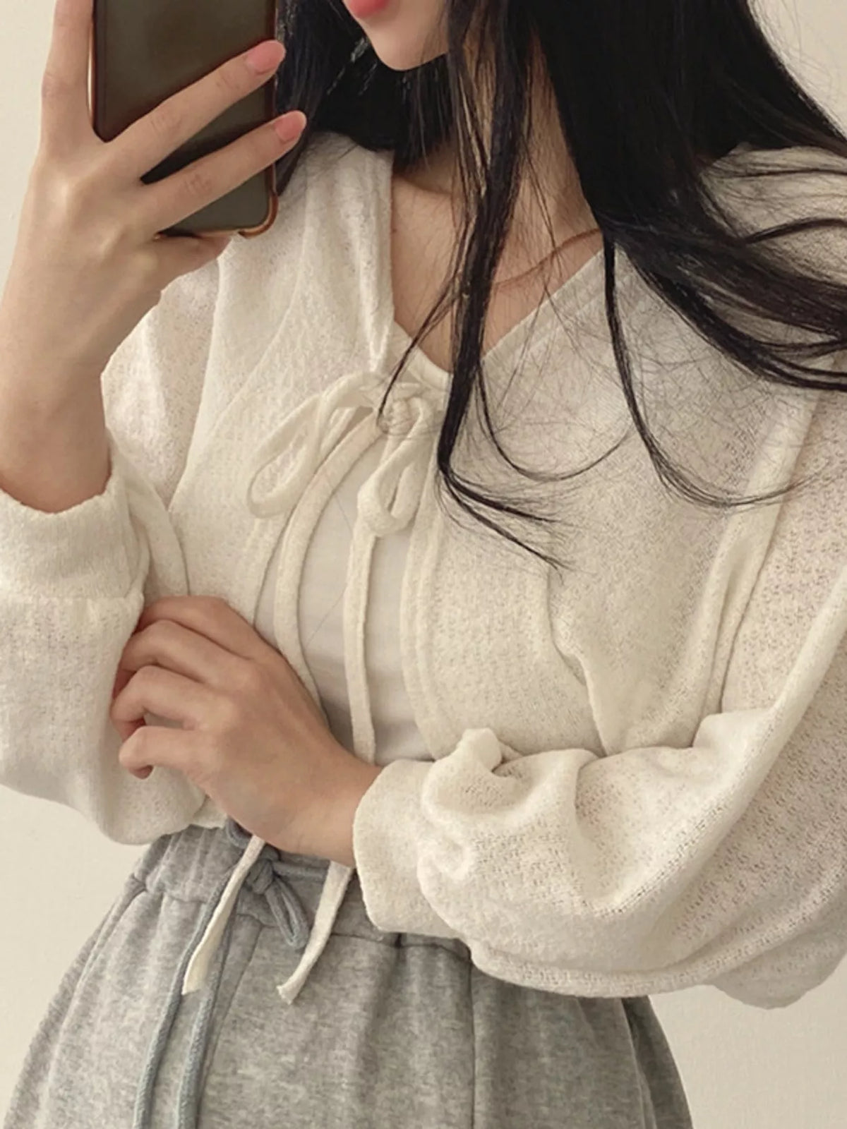 Round neck long sleeve cardigan, construction and design details