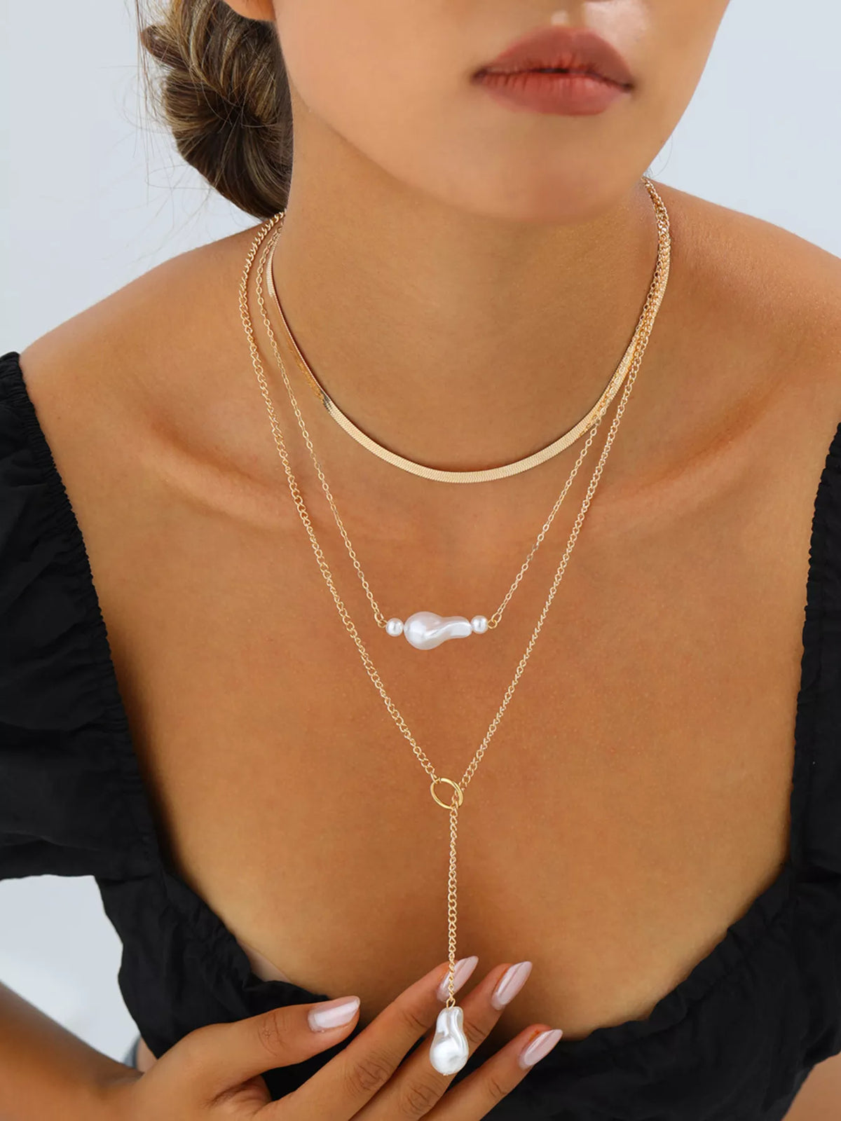 Gold three-layer pearl necklace