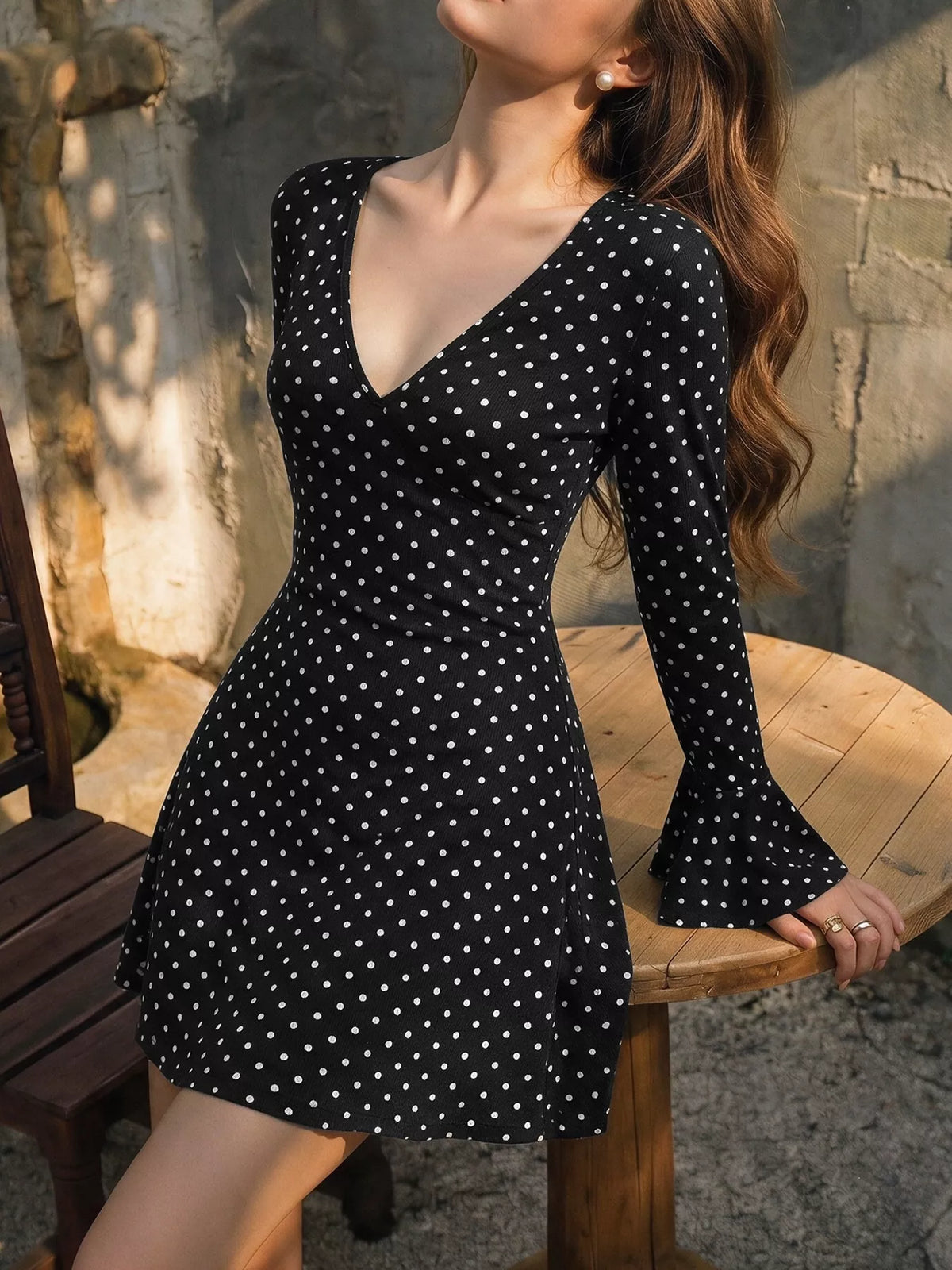 Black polka dot flounce sleeve mini dress, flounce cuff view