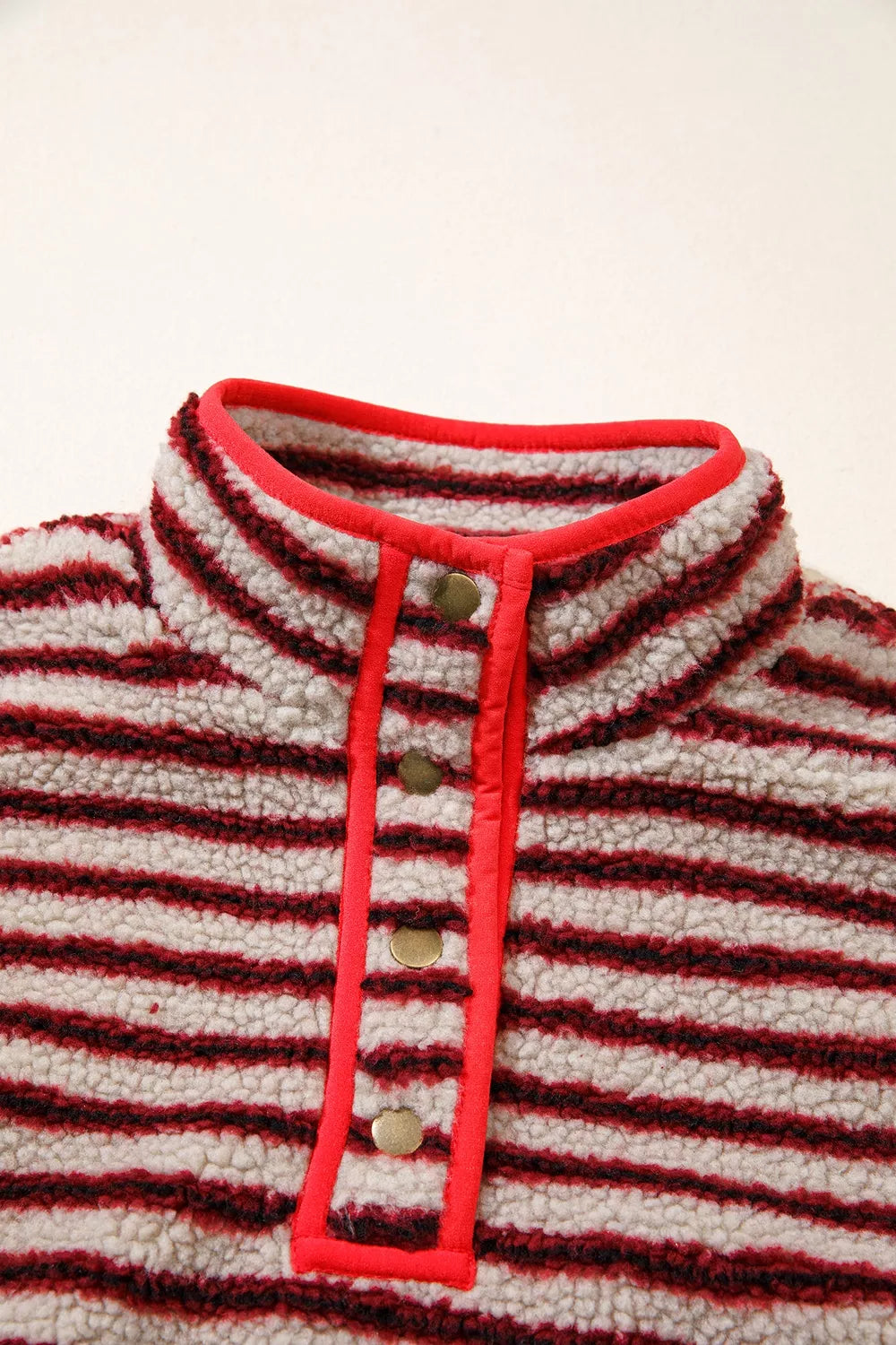 Red and cream striped fuzzy snap-placket sweatshirt, stand collar detail