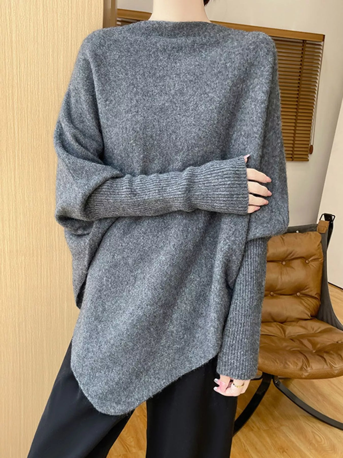 Gray asymmetrical lantern sleeve sweater — front view