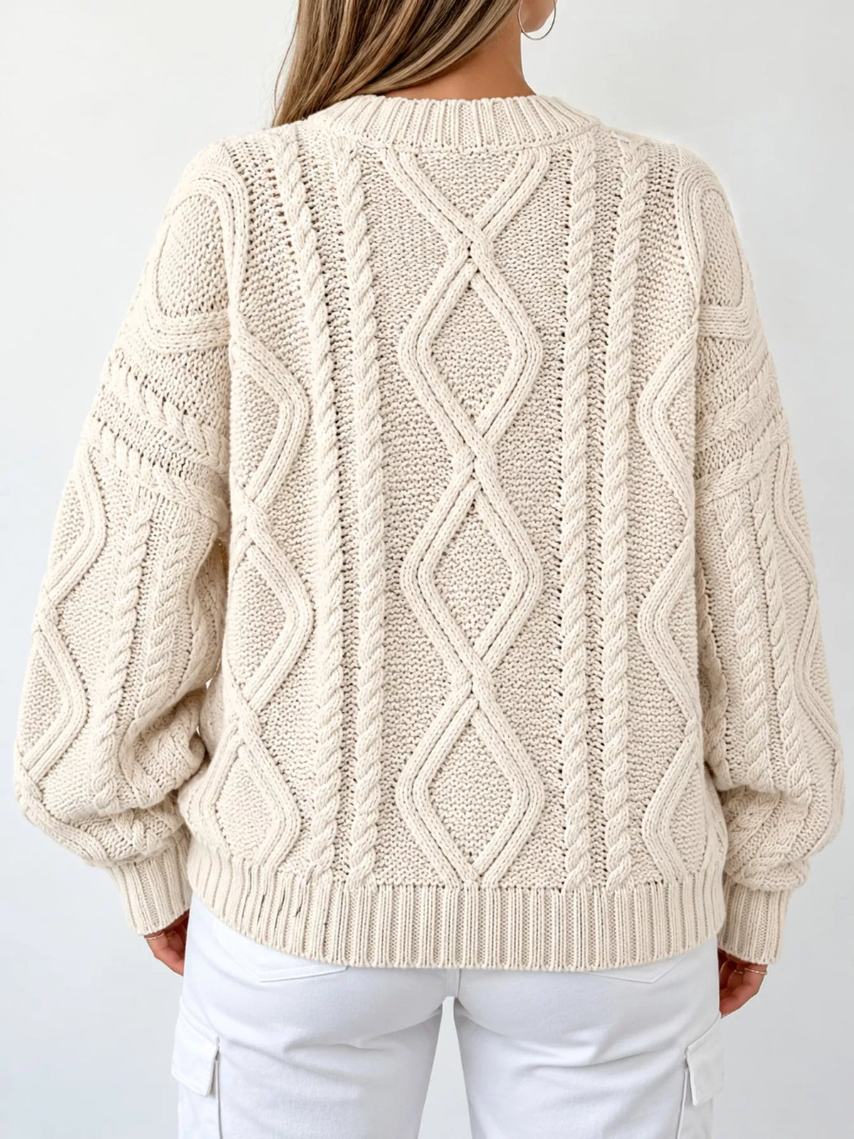 Apricot cable-knit round neck sweater, back view