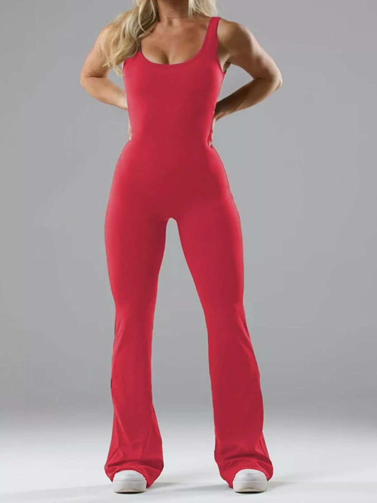 Red scoop-neck flared-leg active jumpsuit, full front view.