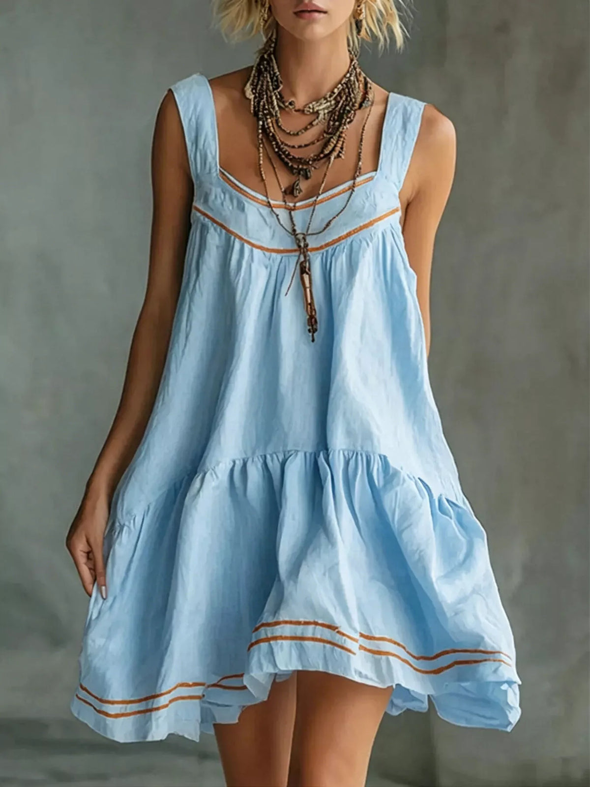 Sleeveless Tiered Mini Dress in blue, front view