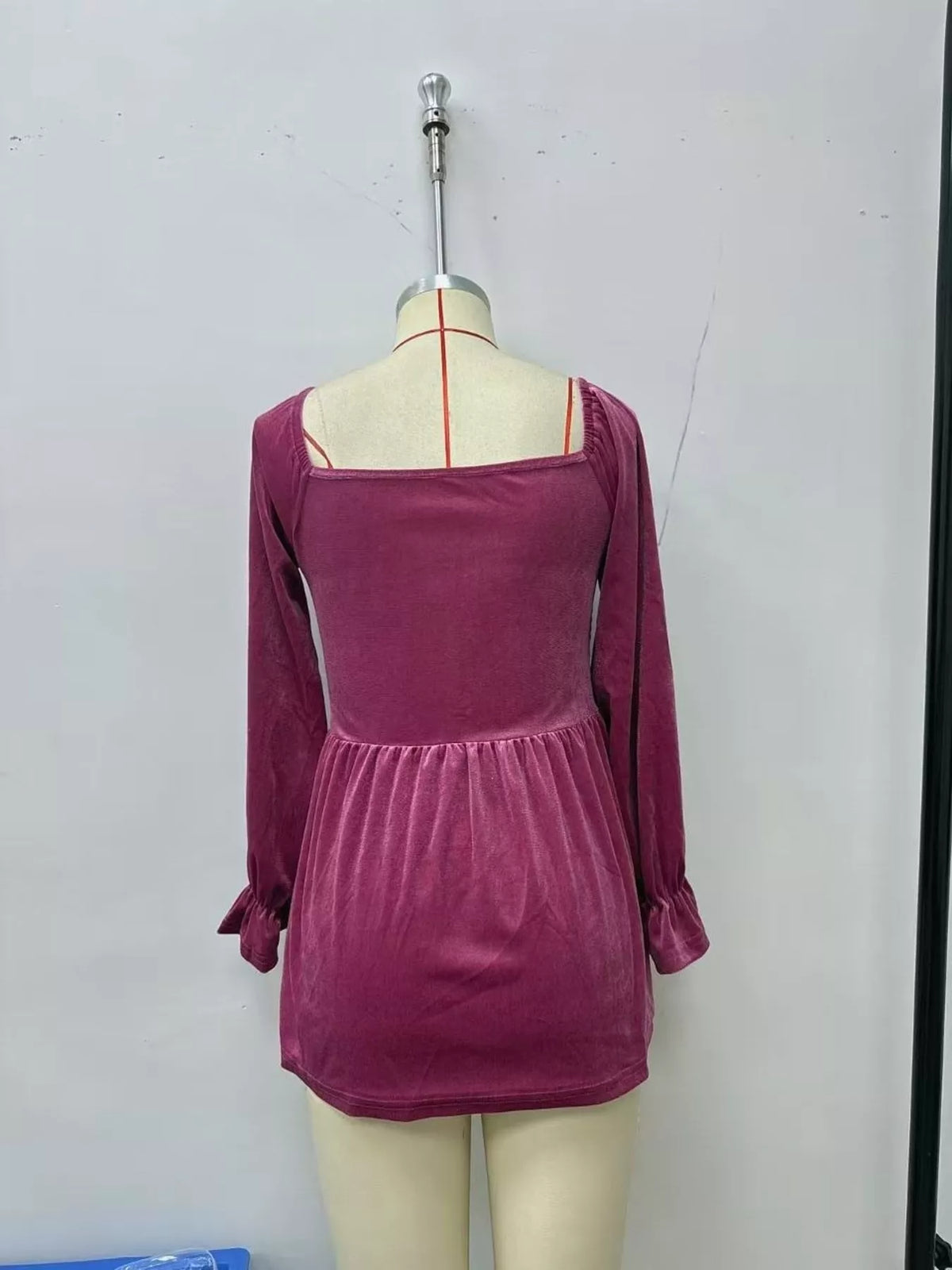 Women's Velvet Smocked Peplum Blouse in Mauve, back view