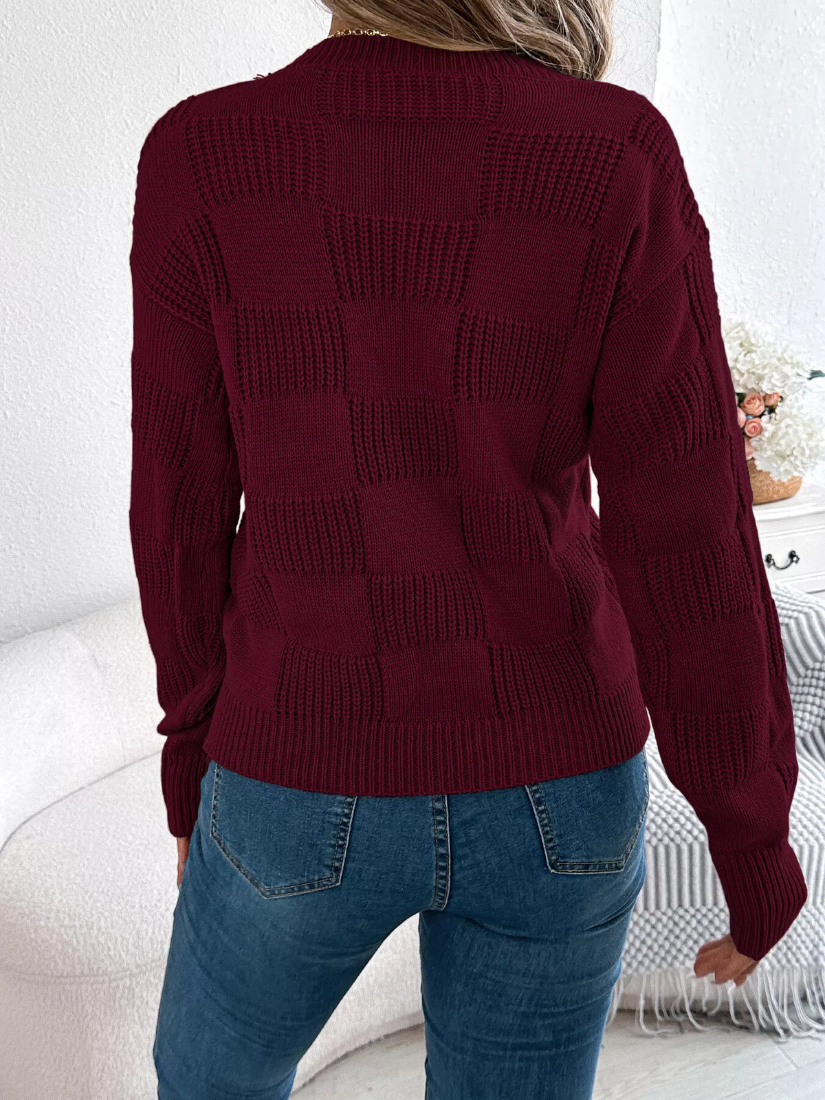 Checkerboard textured knit sweater, back view