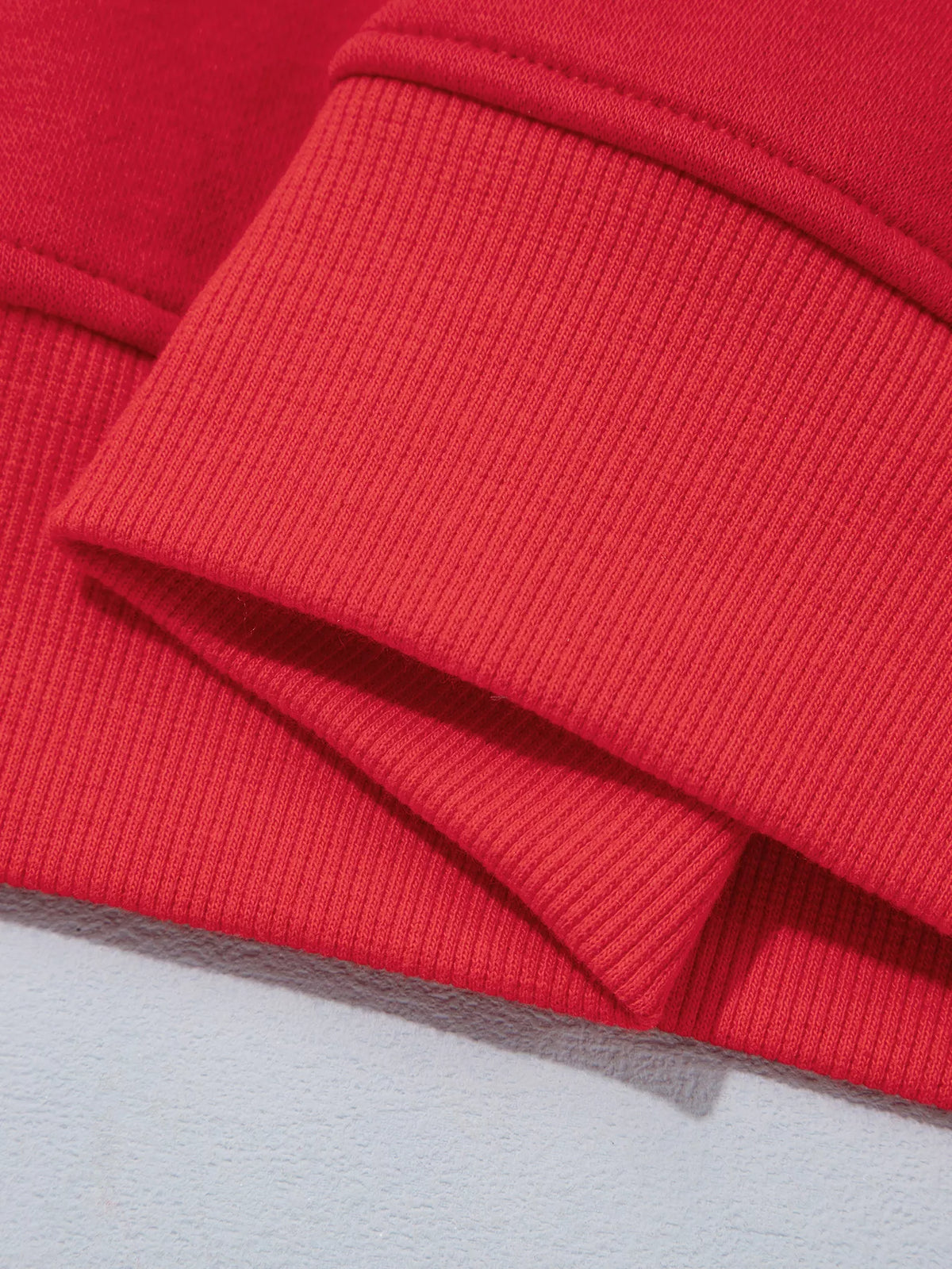 Red gingham sleeve slogan sweatshirt, detail view