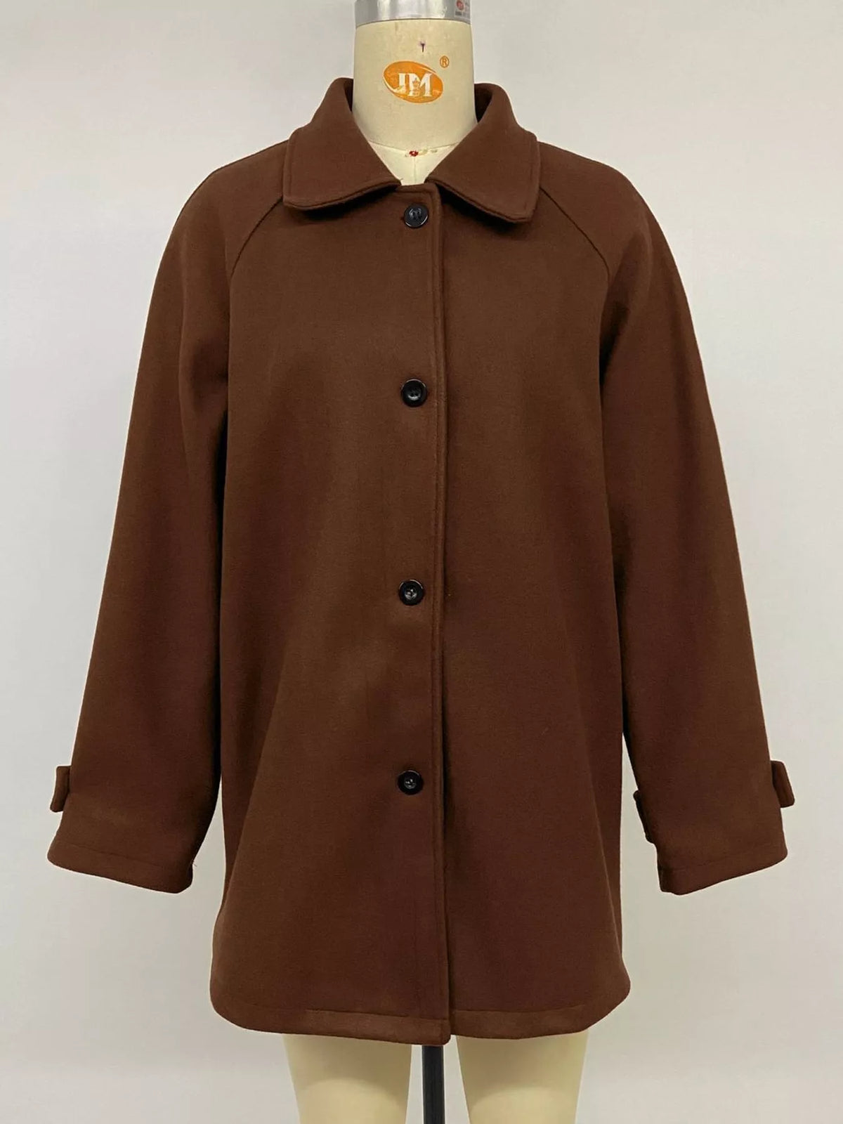 Brown button-up raglan sleeve coat — front view