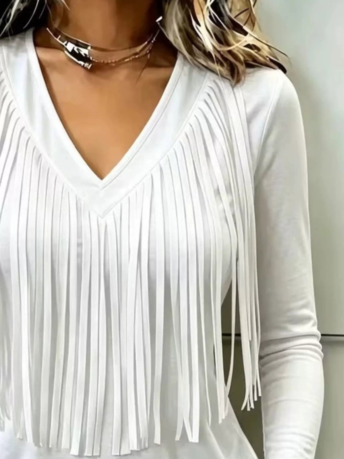 White fringe V-neck top, neckline and fringe close-up