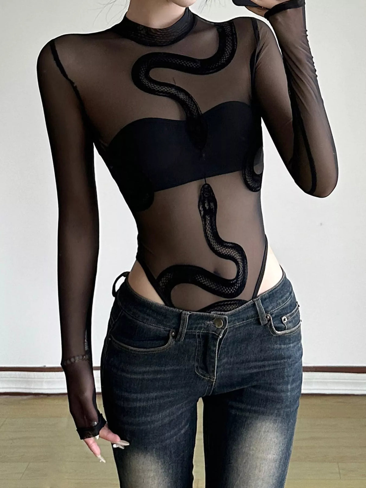 Black sheer mesh snake-motif bodysuit