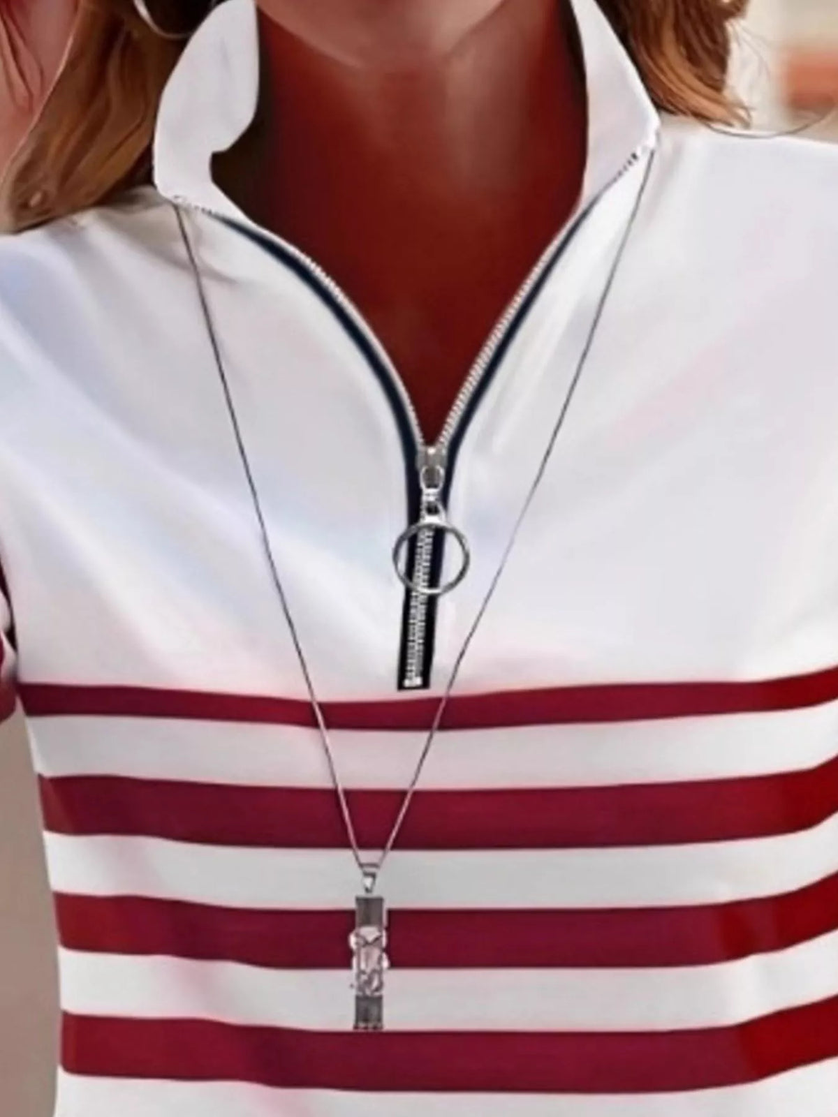 Red and white quarter-zip striped top, neckline detail