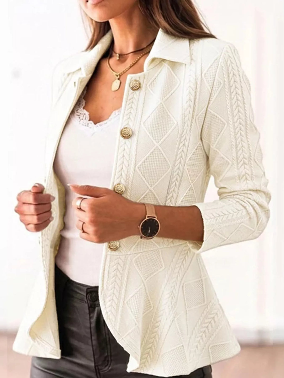White cable-knit button-up cardigan — front view