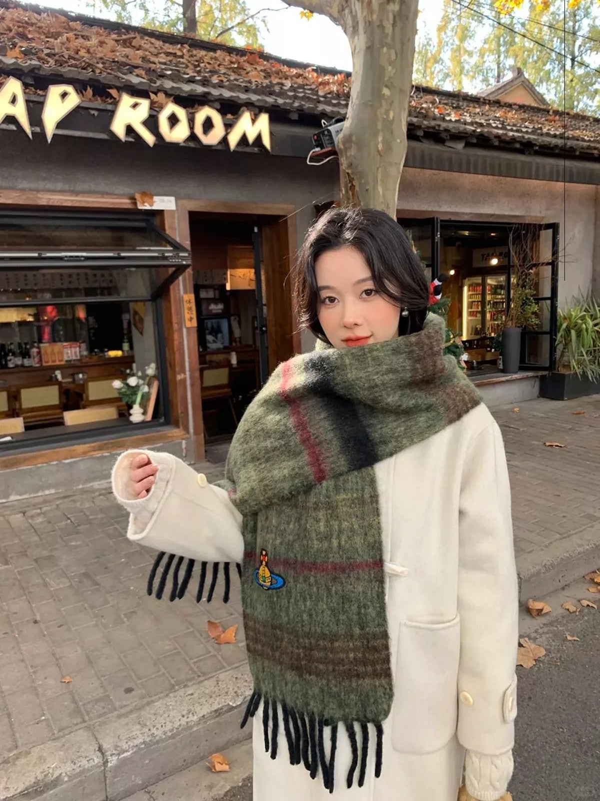 Embroidered Orb Logo Plaid Scarf, shown worn