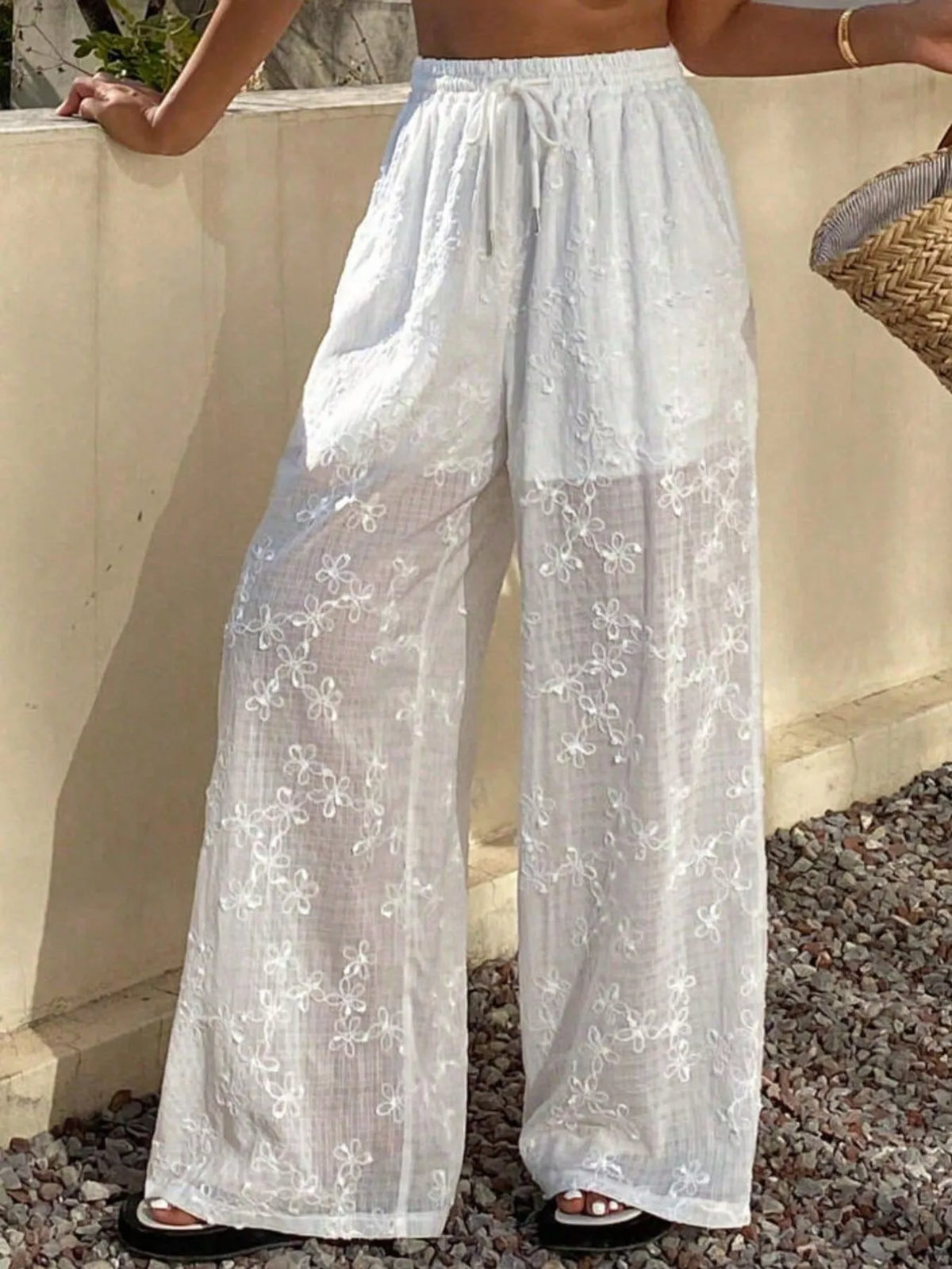 White sheer floral embroidered wide-leg pants, front view showing drawstring