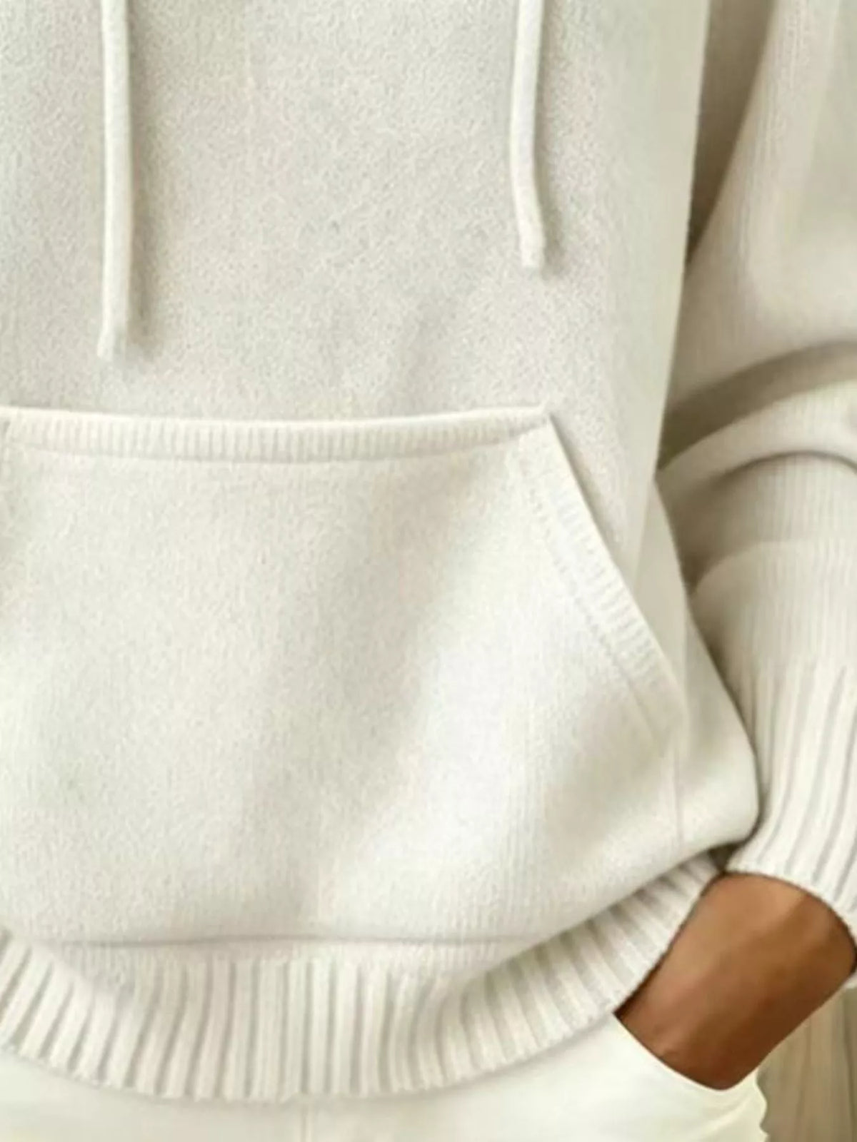 Women's Drawstring Kangaroo Pocket Hooded Sweater in cream — pocket detail view