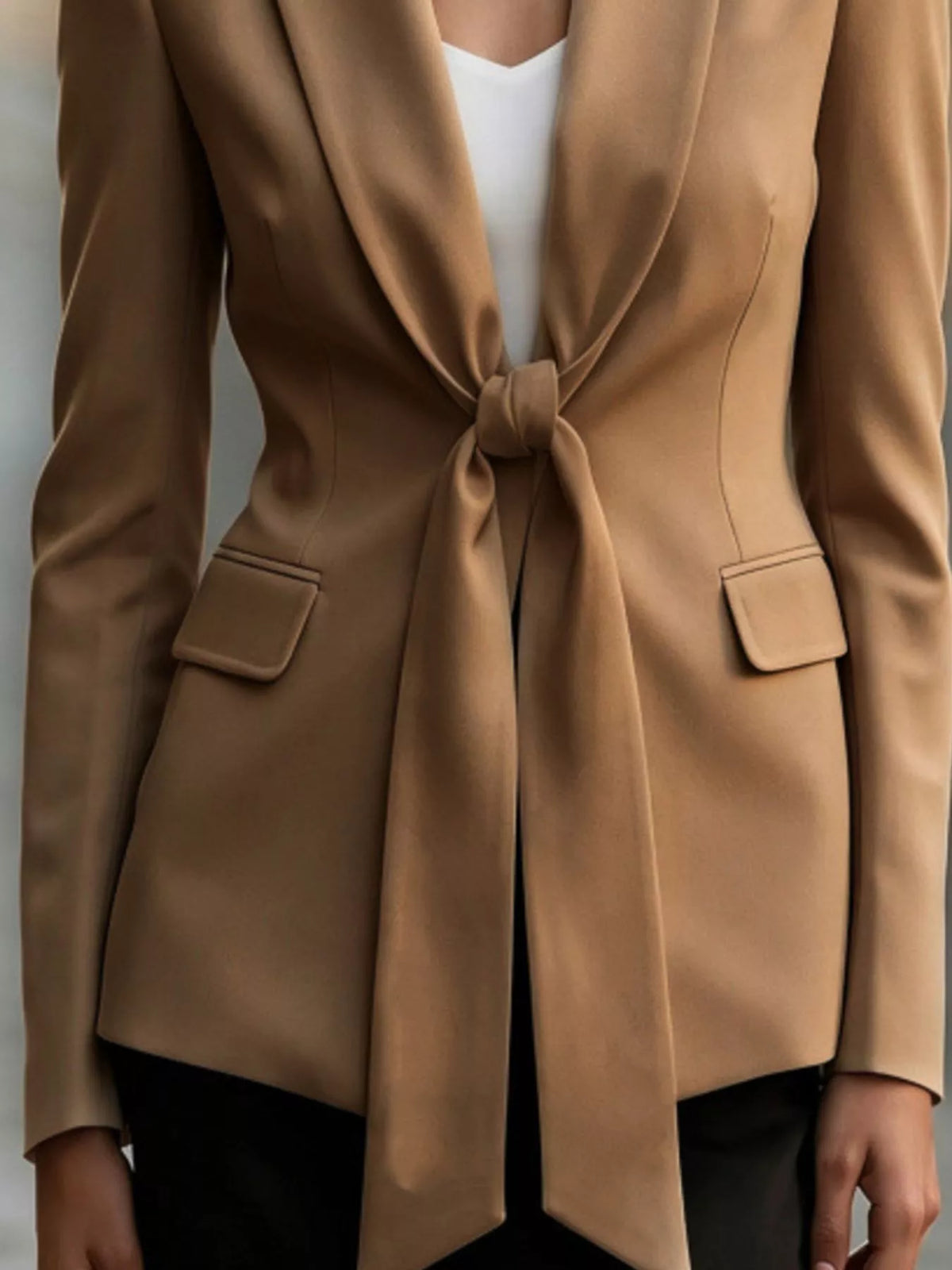Tie-front lapel collar blazer in brown, front tie and pocket detail