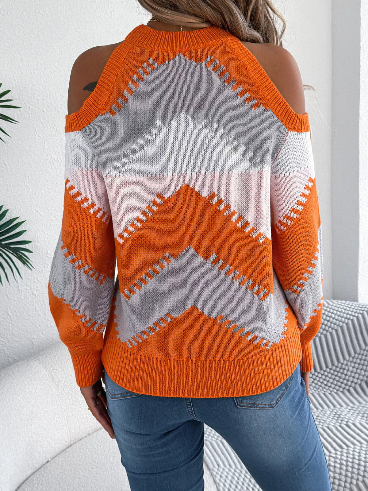 Orange cold shoulder chevron pattern knit sweater, back view