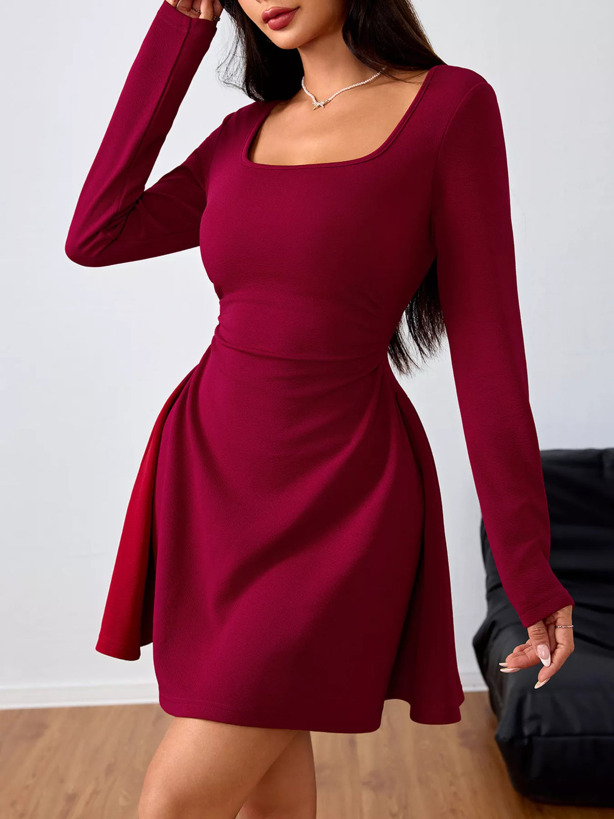 Burgundy square-neck ruched-waist mini dress, standing front view.