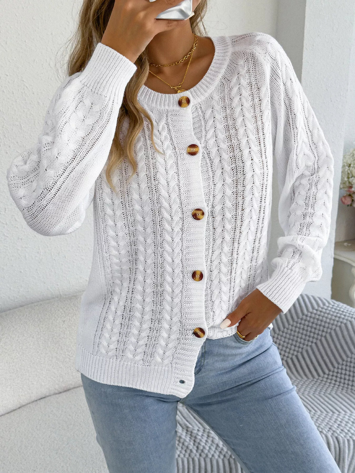 White cable knit button-front cardigan