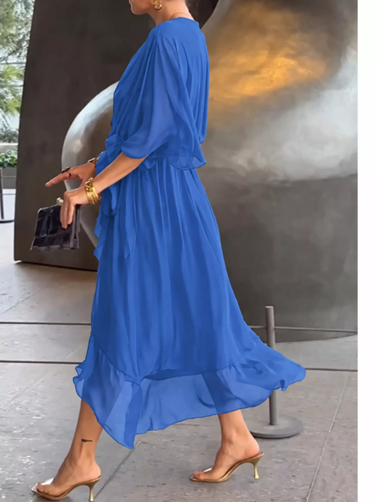 Blue batwing sleeve wrap dress with waist tie, side view