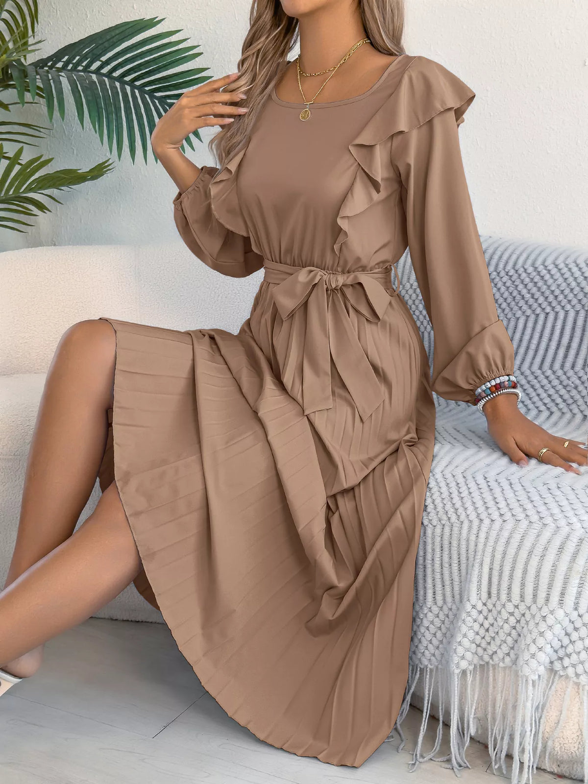 Taupe ruffled pleated tie-waist midi dress, seated front view.