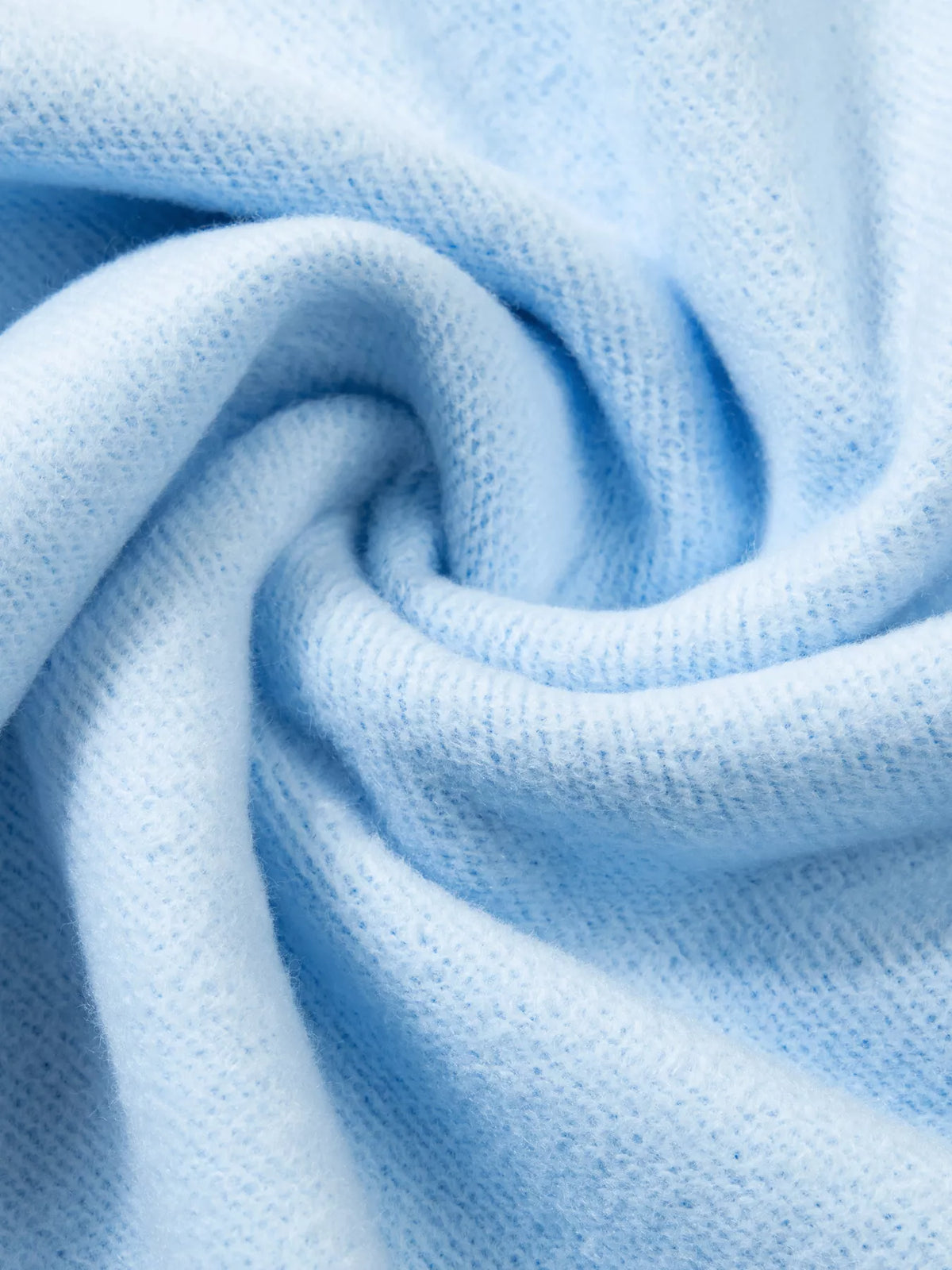 Fabric close-up on light blue jesus saves stand neck oversized sweatshirt