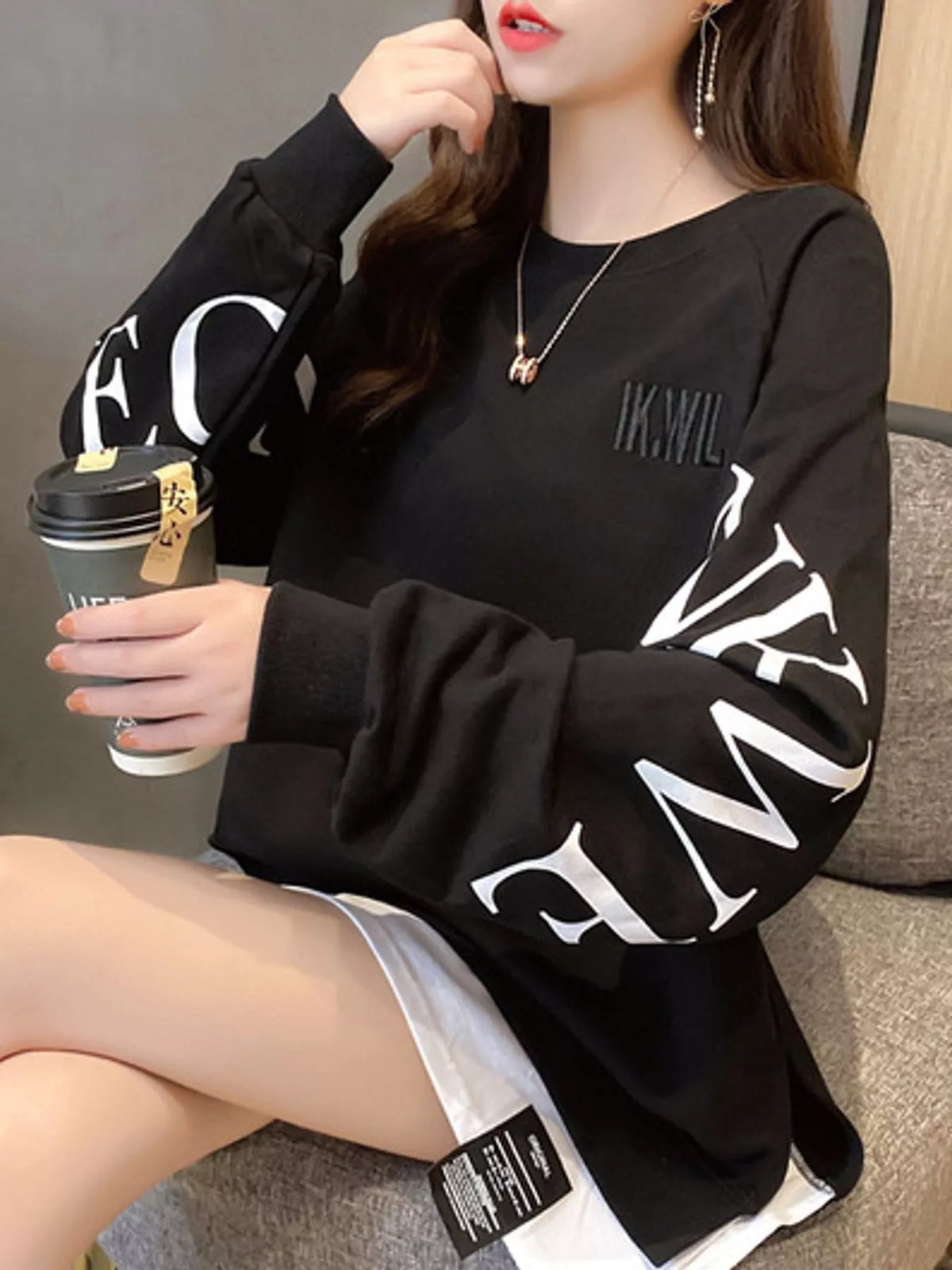 Black layered-hem sweatshirt with graphic sleeve detail