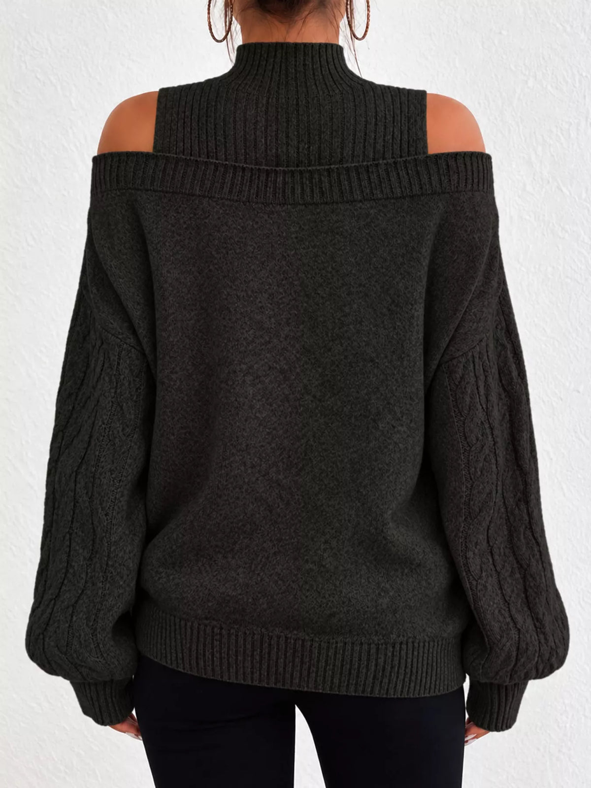 Black cold shoulder mock neck cable knit sweater, back view