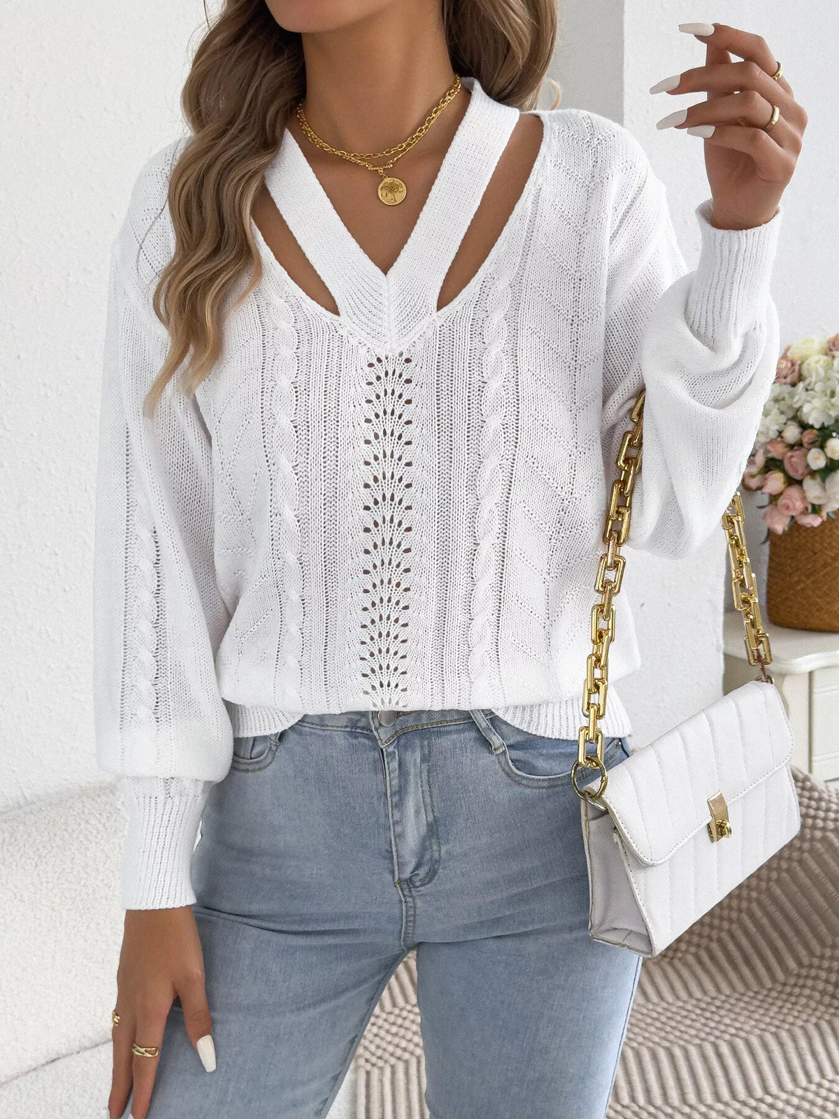 Orange cut-out cable knit sweater