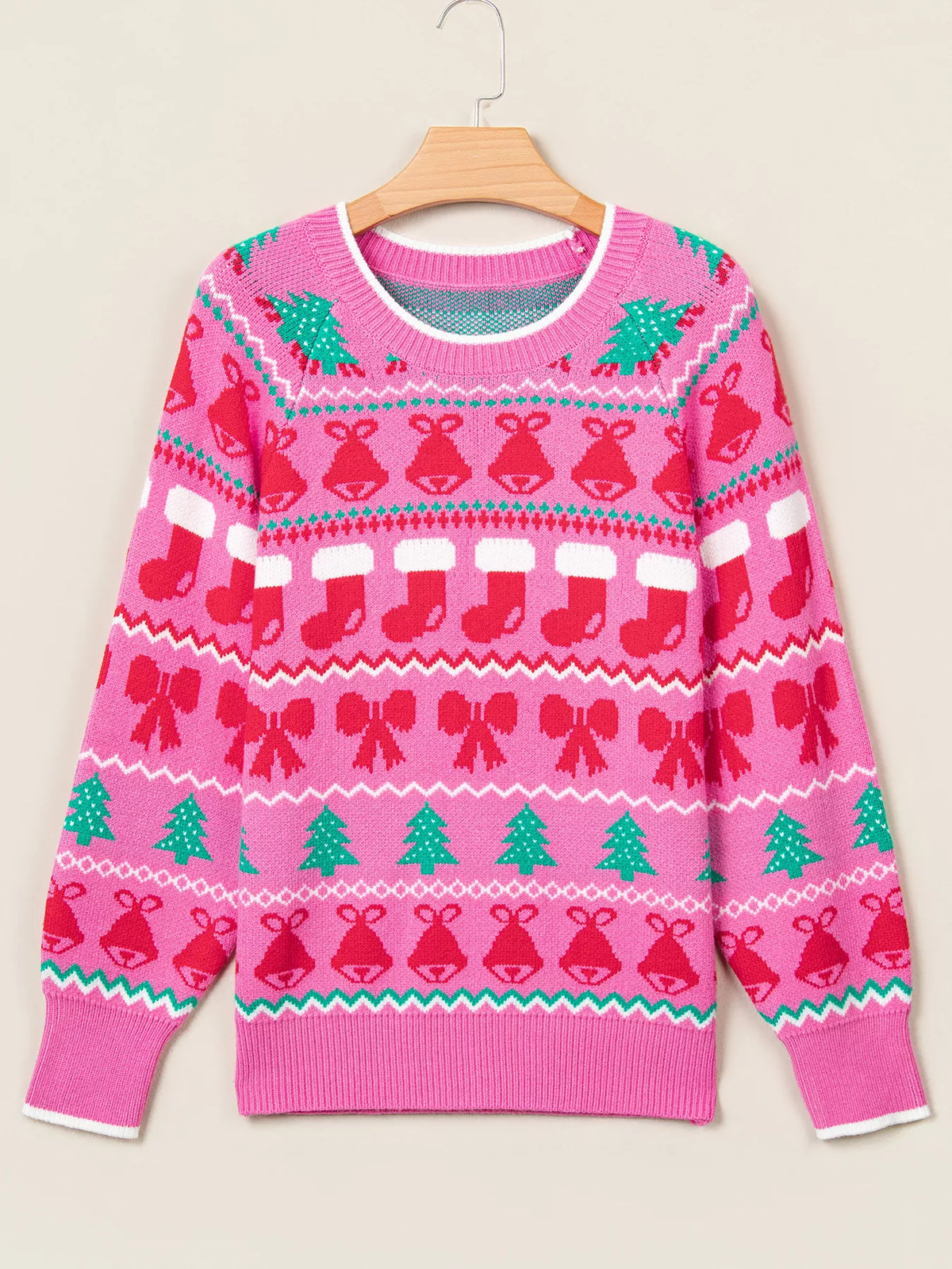Pink Christmas graphic sweater, front on hanger
