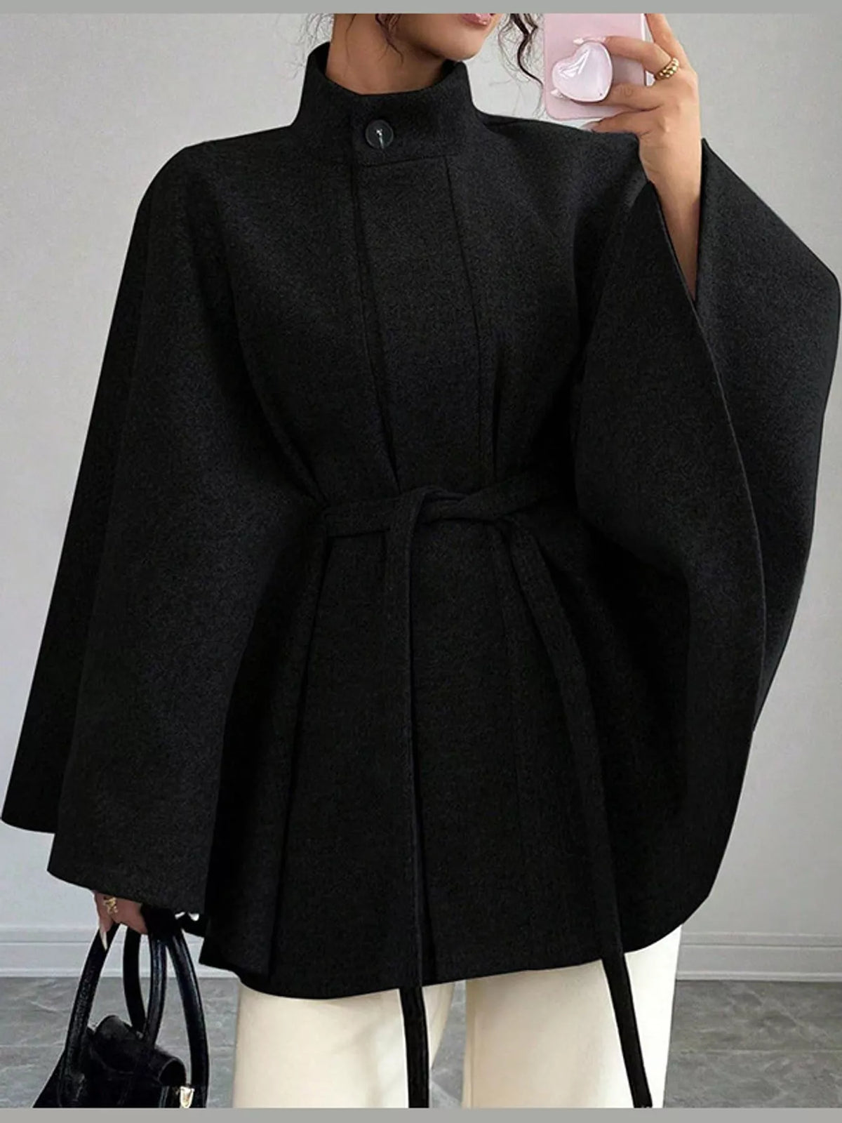 Black tie-waist cape — front view
