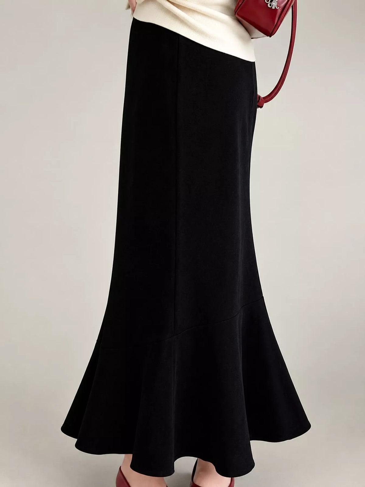 Black high-waisted flared skirt, back view