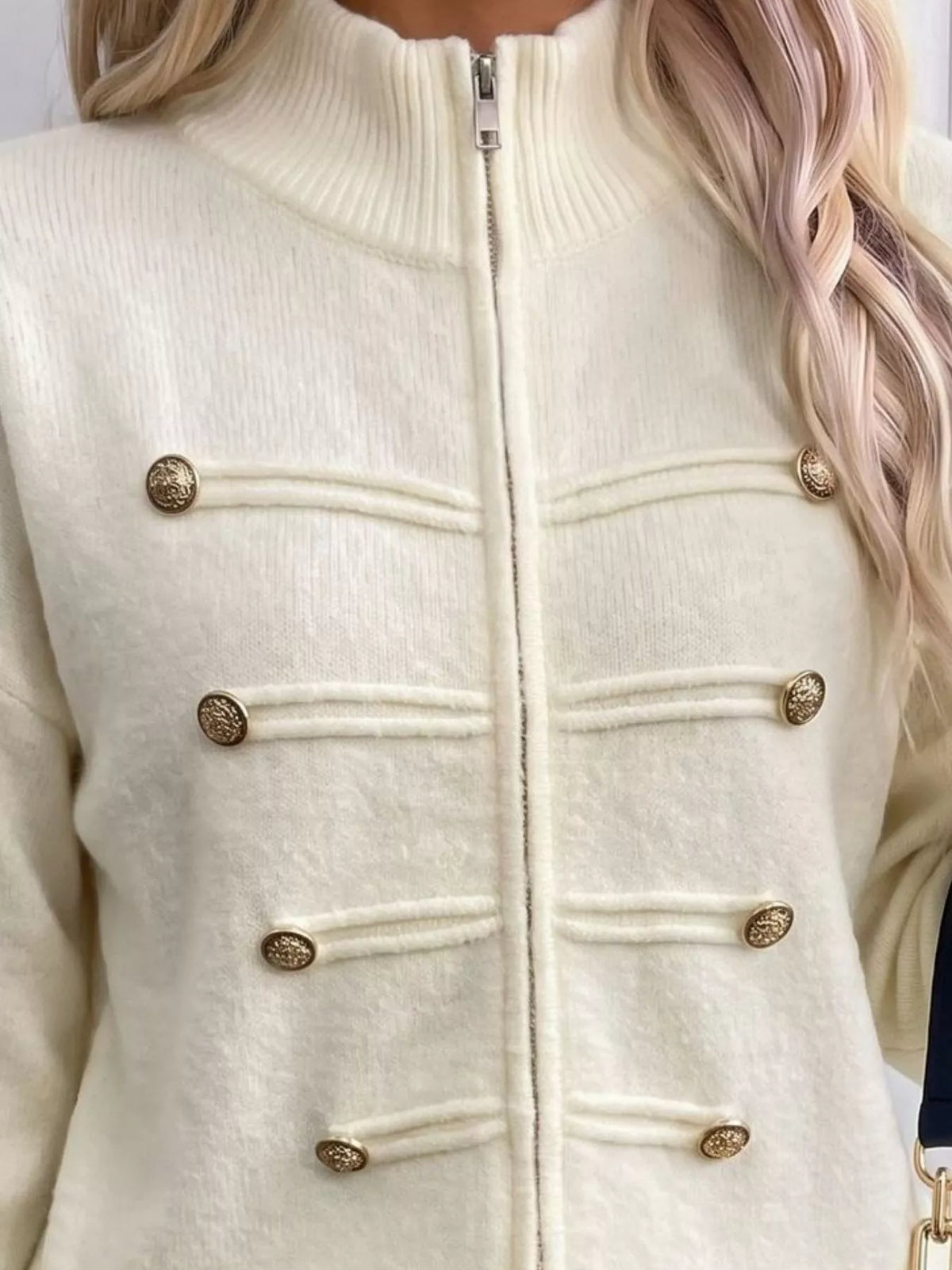 Ivory zip-up long sleeve cardigan with decorative buttons, zipper and decorative button detail