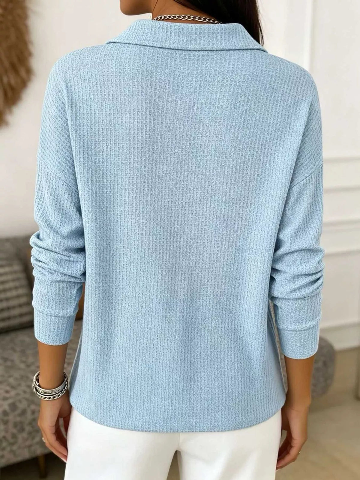 Light blue waffle knit snap-front blouse, back view