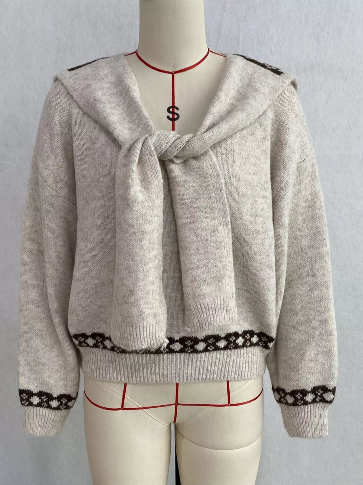 Ivory scarf-detail dropped-shoulder sweater, front on dress form.