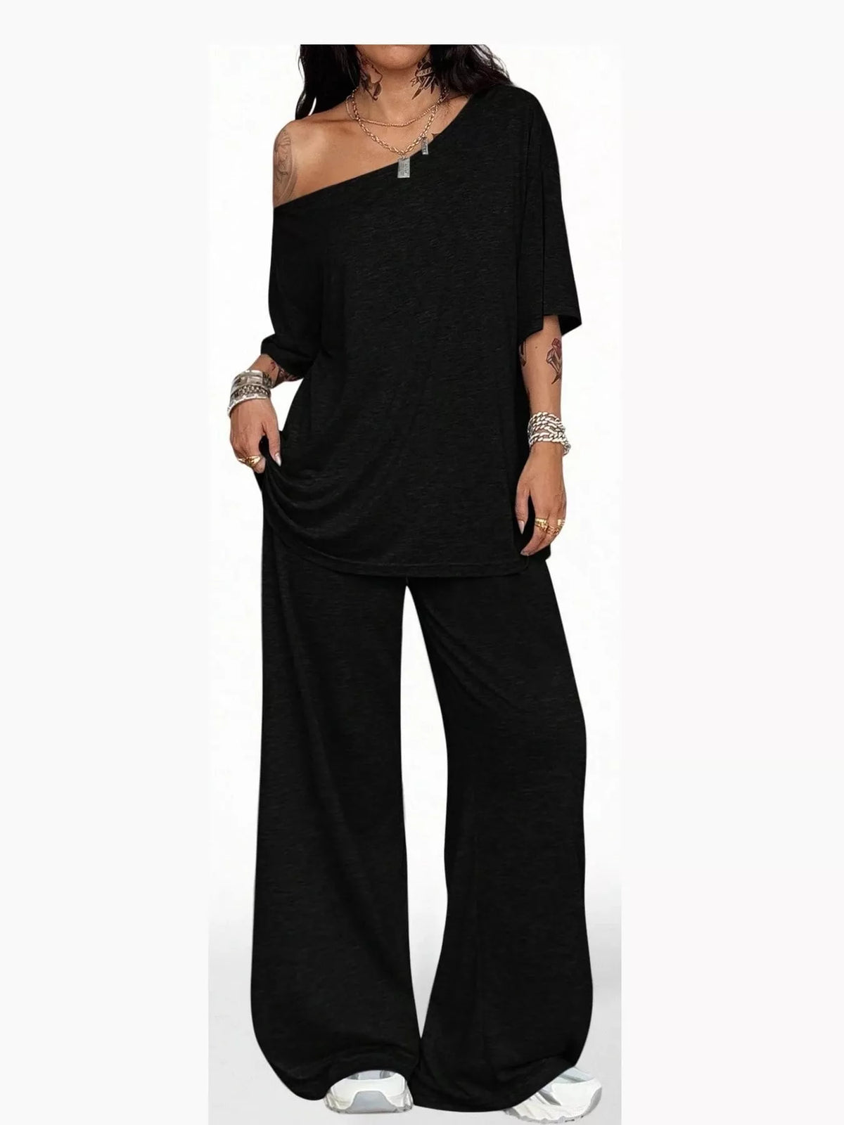 Black boat neck top and wide-leg pants set — front view