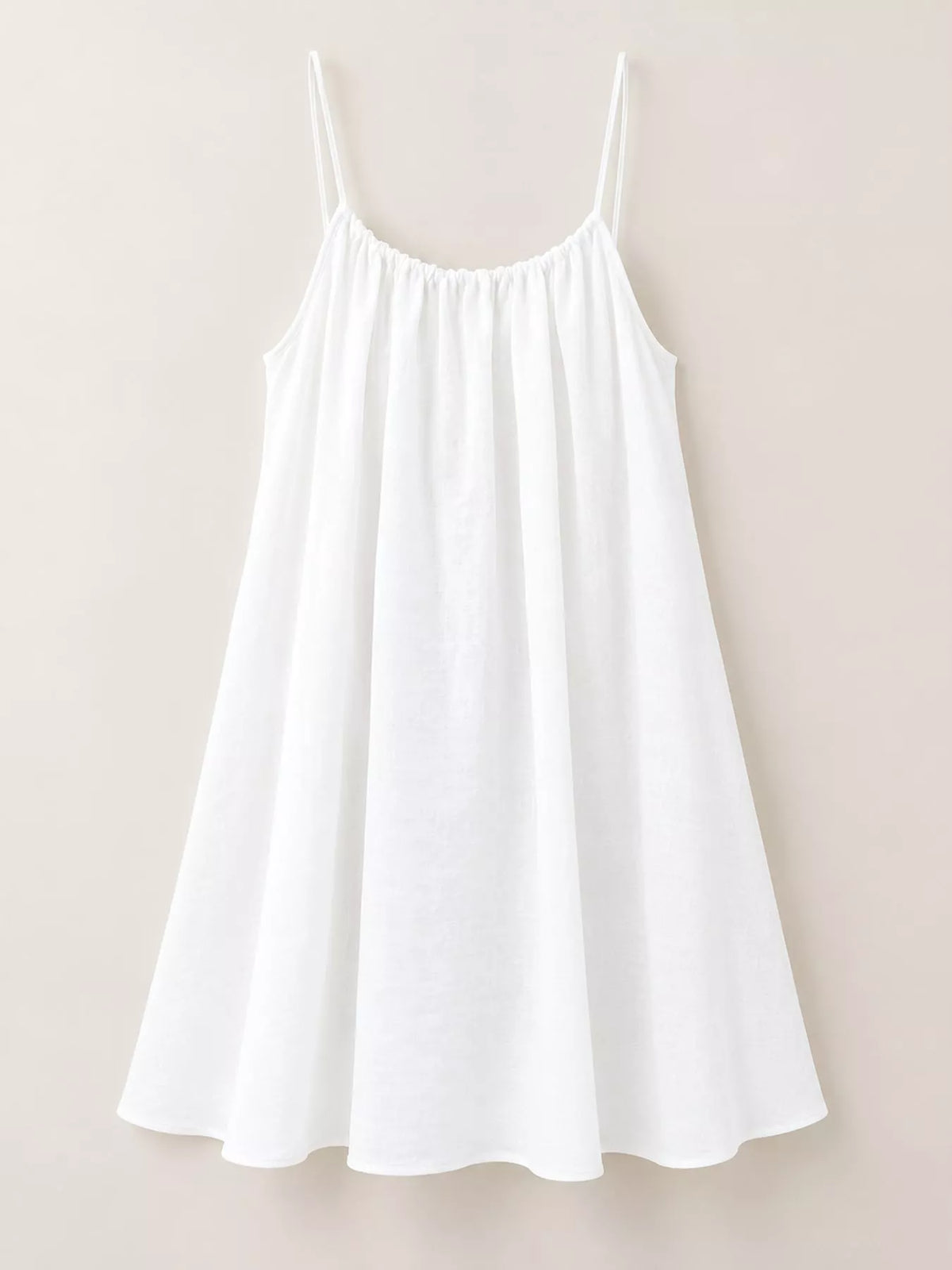 White spaghetti strap A-line mini dress with open tie back