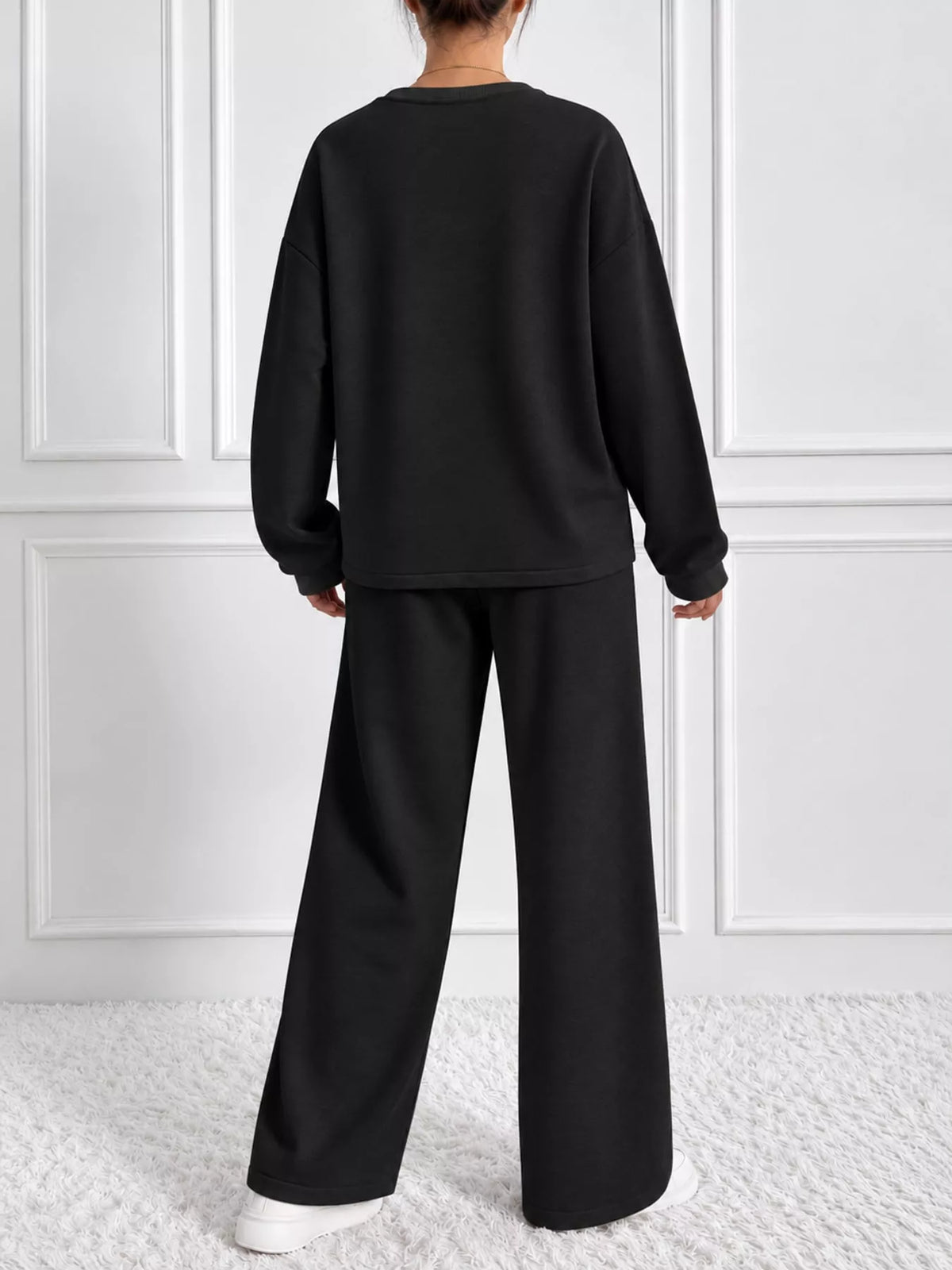 Black oversized sweatshirt and wide-leg pants set — back view