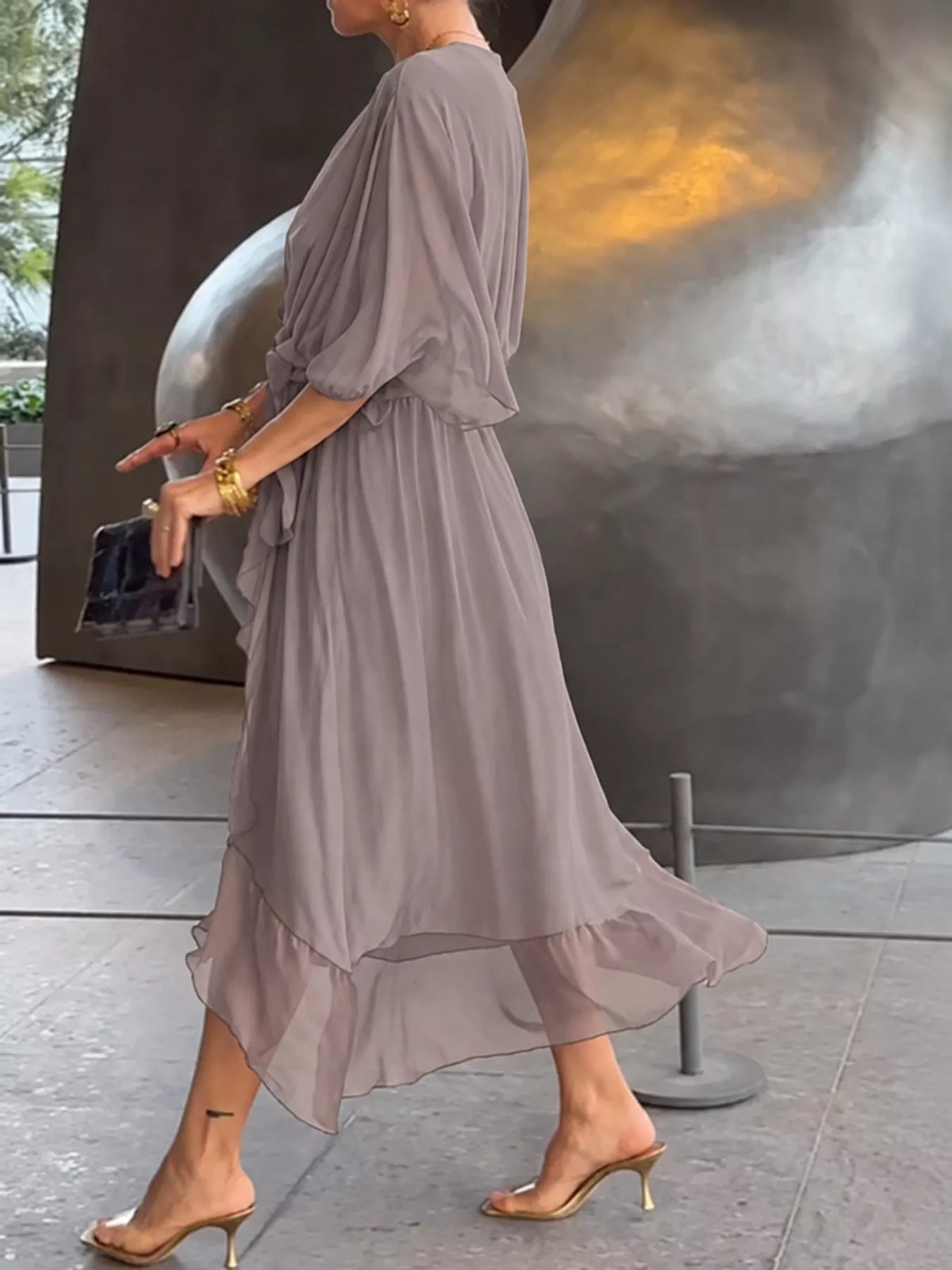 Gray batwing sleeve wrap dress with waist tie, side view