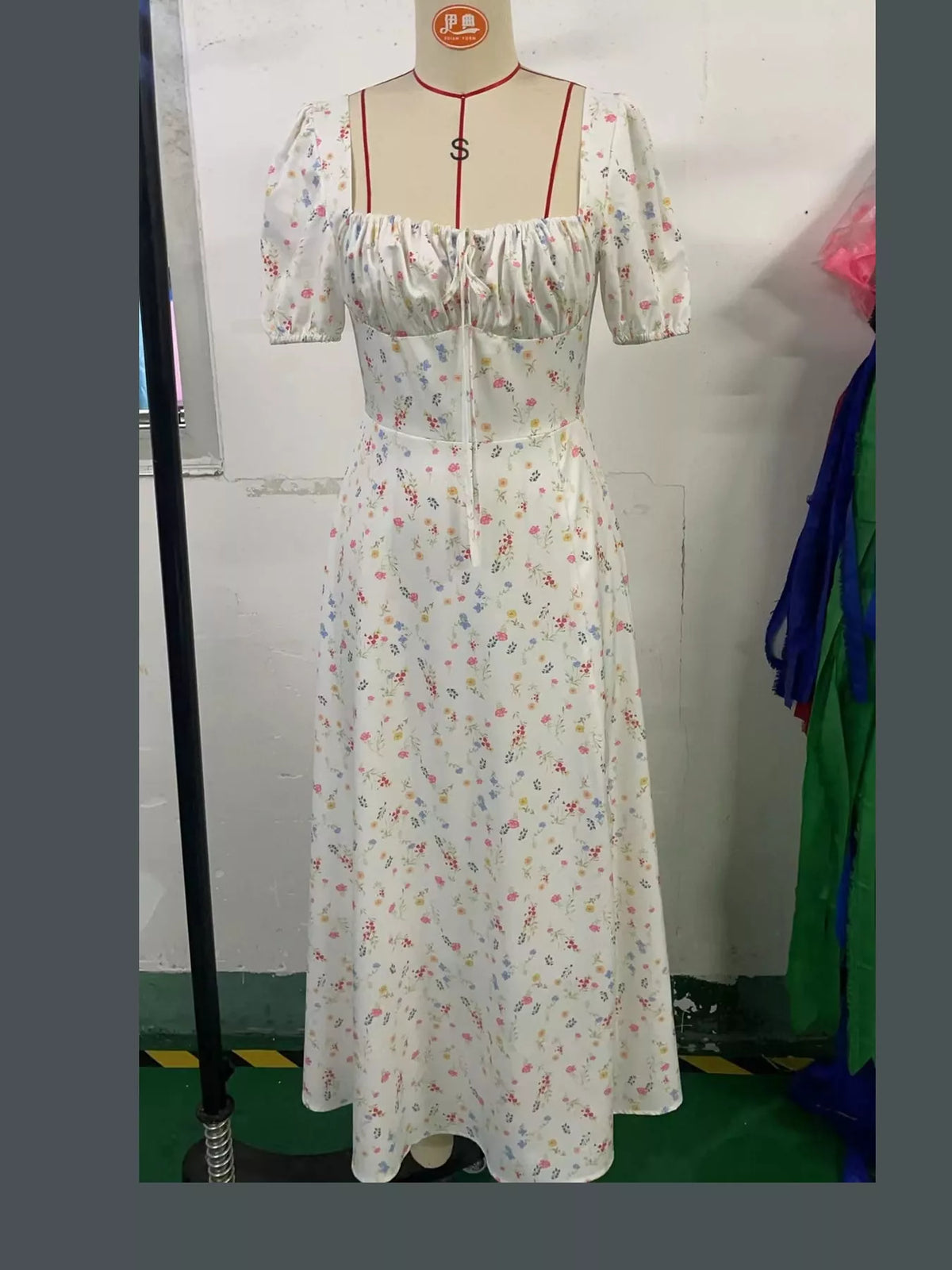 Women's Paneled Bodice Gathered Midi Dress in small floral — mannequin front view