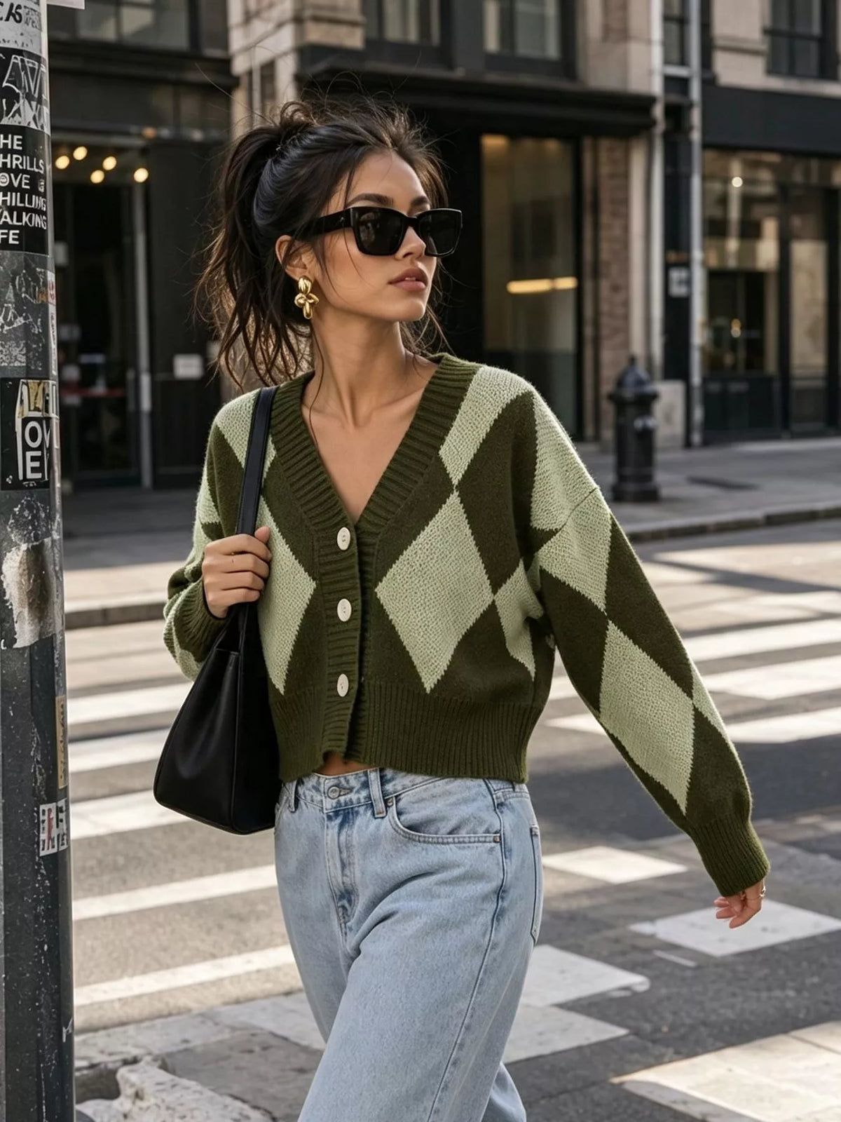 Green argyle v-neck button-front cardigan, walking front view.
