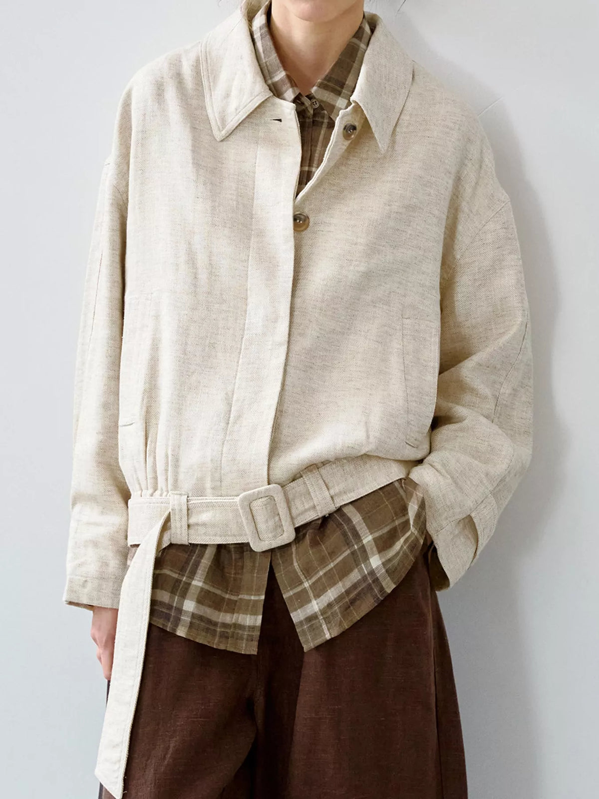 Cream belted dropped shoulder jacket — front view