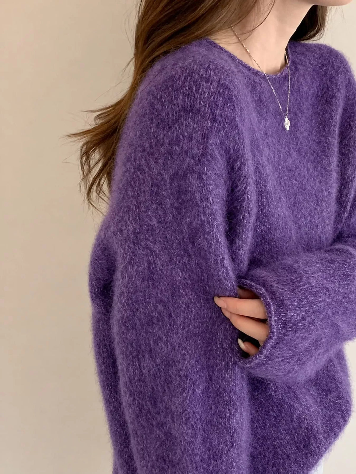 Round neck long sleeve sweater, side view