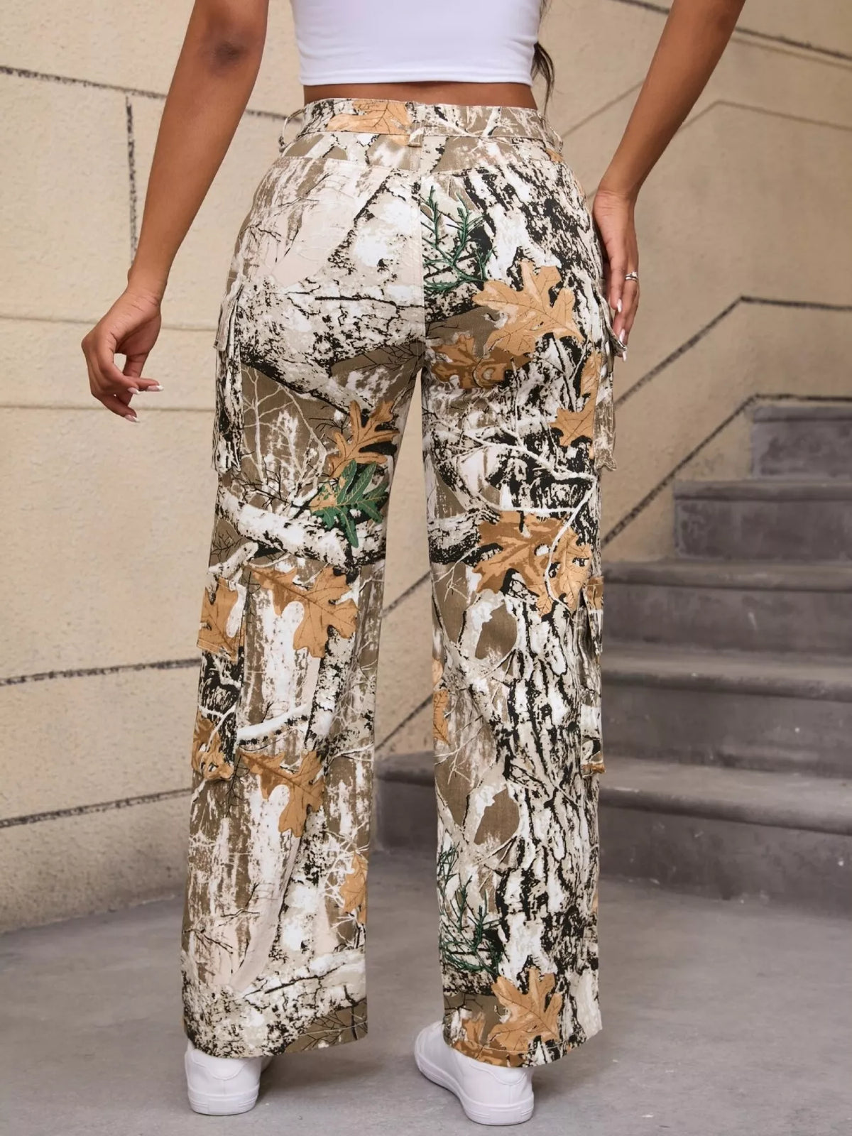 Beige and green high-waisted camouflage cargo pants, back view.