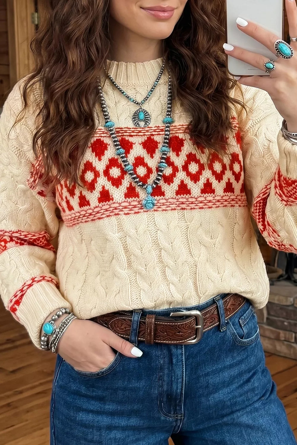 Ivory geometric cable-knit crewneck sweater, front geometric band detail.