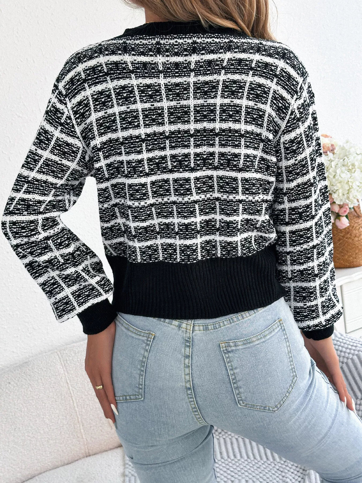 Black plaid tweed-style knit cardigan, back view