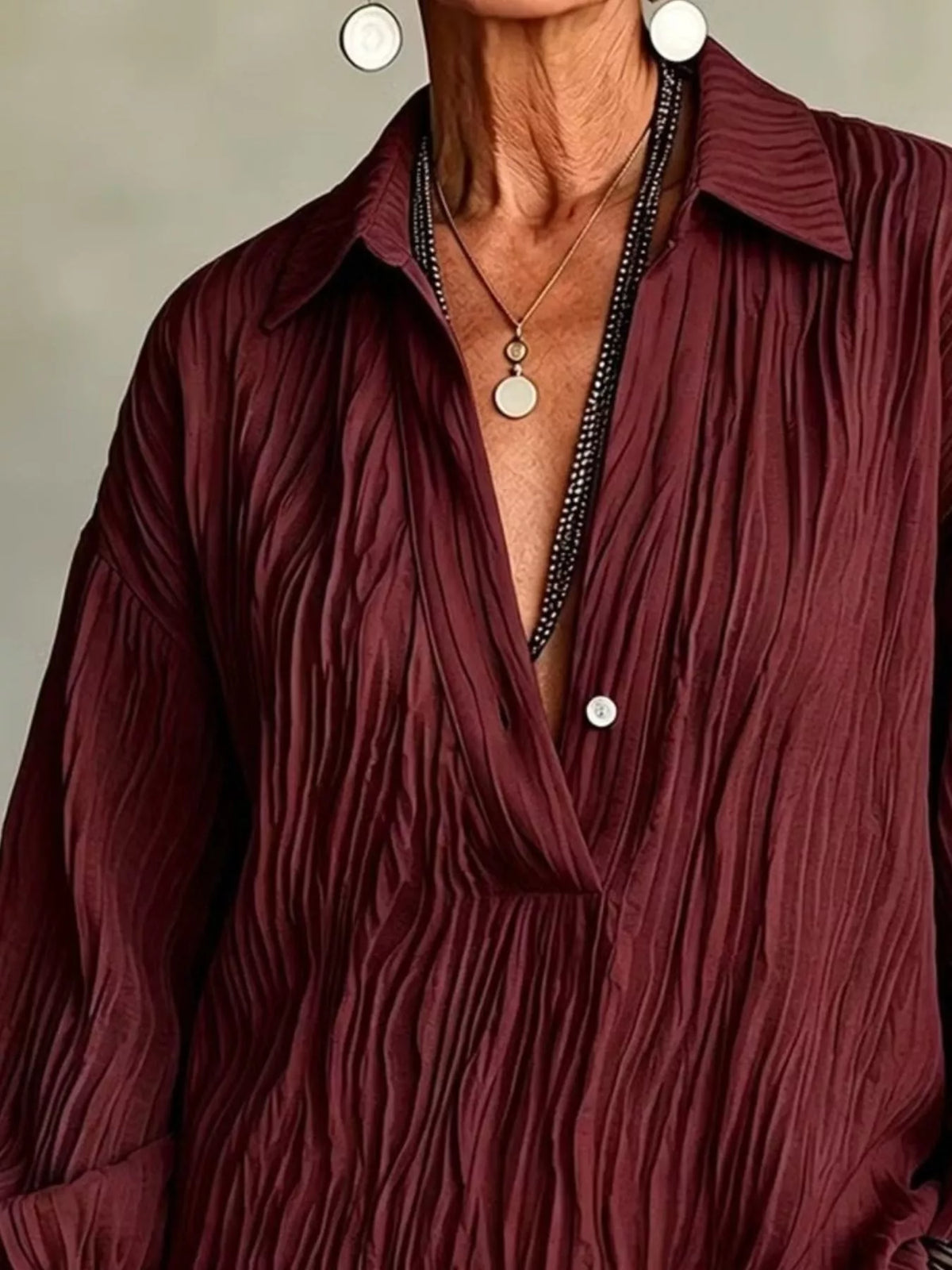 Burgundy textured blouse, collared neckline and textured front